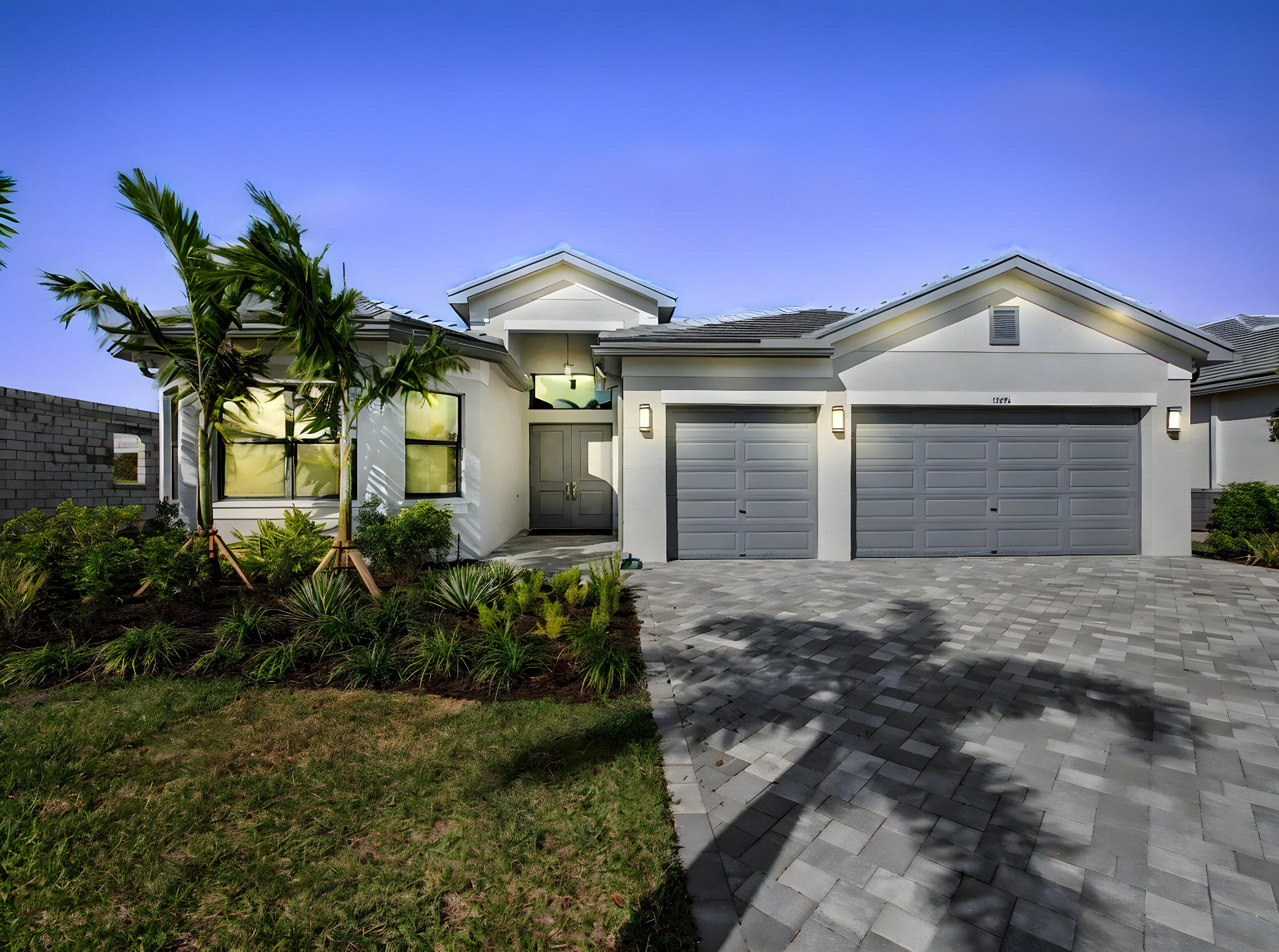 Valencia Walk at Riverland - Port St. Lucie's best 55+ lifestyle with a million ways to have fun including a beautiful 37,000-square foot Clubhouse w/ resort-style amenities. This Julia model includes private views and an open floor plan w/ contemporary porcelain 24"x24" matte tile flooring throughout the entire home.  The home features high end finishes including impact glass windows, GE Profile gas appliances, tile roof and recessed LED lighting.  The spacious kitchen includes high end quartz countertops with a full quartz backsplash, two tone painted maple cabinets bright white and dove, custom cabinet pantry built-in, above and below cabinet lighting, and GE Profile stainless-steel appliances w/ a chimney hood. Includes upgraded decorative lighting and window treatments worth $15,000. All bathrooms include high end quartz countertops and upgraded vanity cabinets.    Valencia Walk offers access to the amazing facilities found throughout the 4,000 acres of master-planned amenities at Riverland, where bigger is better! Stay fit at the 24-acre Sports & Racquet Club that offers over 80 outdoor sports courts and a 51,000 square-foot Wellness & Fitness Center. At Riverland you'll also find ways to express yourself at the 5-acre Arts & Culture Center, a bustling Town Center, the 12-acre Paseo Park among many future city parks and much, much more! You'll be able to easily access it all with the 5 miles of gorgeously landscaped traffic-free Paseo and greenways that connects everyone and everything throughout Riverland like never before - all that's missing is you! CALL FOR MORE DETAILS AND TO SCHEDULE TIME TO PREVIEW.