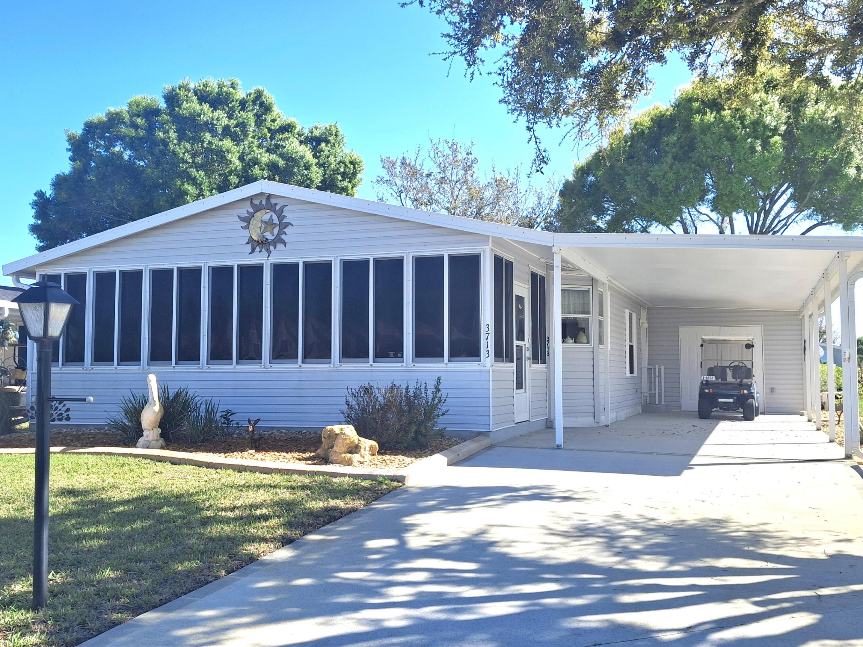 Stunning, remodeled, partially furnished & turnkey,  2-bedroom, 2-bath home located on a quiet cul-de-sac, offering modern upgrades and move-in-ready convenience. The beautifully updated chef's eat-in kitchen features elegant granite countertops, soft-close drawers, and stainless-steel appliances, perfect for everyday living and entertaining. This home also boasts remodeled bathrooms, luxury vinyl plank flooring in the main areas and a spacious 24x10 air-conditioned lanai, ideal for relaxing year-round. Additional storage is provided by a super-sized 16x12 shed, which can store the included lithium-battery golf cart. Recent major upgrades include a new metal roof (2021) and new A/C system (2023). The property is sold partially furnished, making it even easier to settle in.