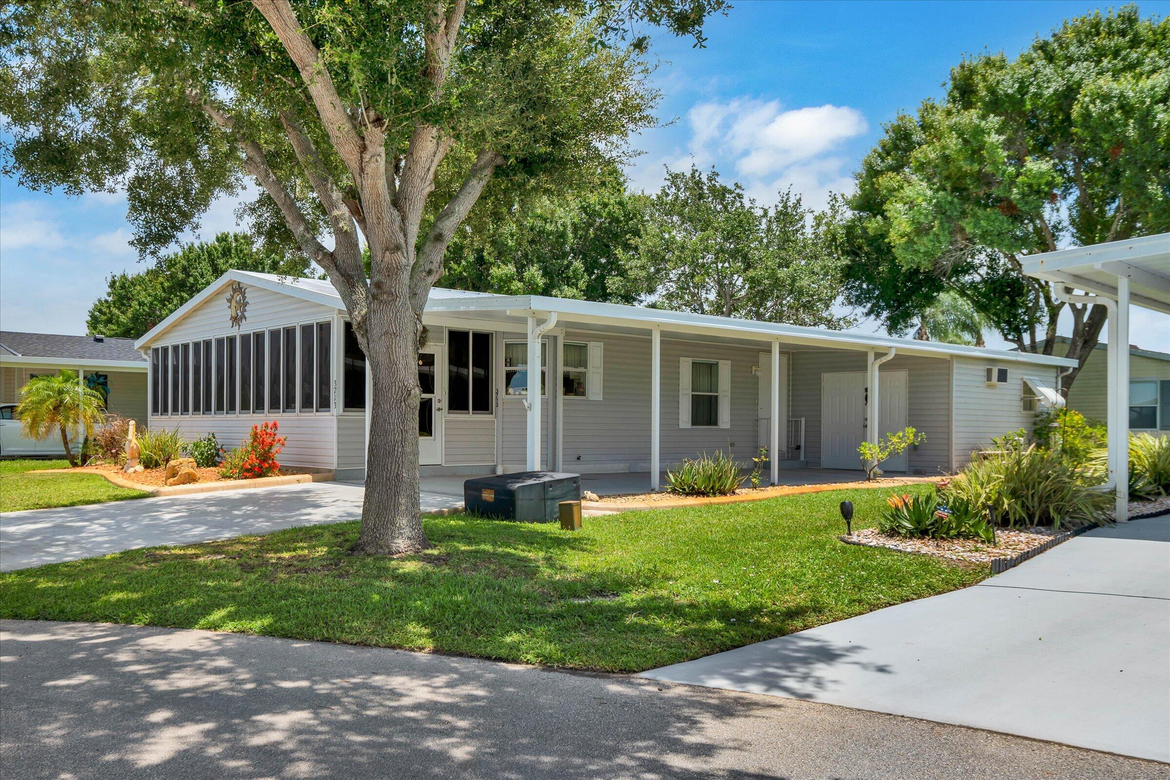 Seller is highly motivated and must sell this stunning, remodeled, furnished, 2-bedroom, 2-bath home located on a quiet cul-de-sac, offering modern upgrades and move-in-ready convenience. The beautifully updated chefs eat-in kitchen features elegant granite countertops, soft-close drawers, and stainless-steel appliances, perfect for everyday living and entertaining. This home also boasts remodeled bathrooms, luxury vinyl plank flooring in the main areas and a spacious 24x10 air-conditioned lanai, ideal for relaxing year-round. Additional storage is provided by a super-sized 16x12 shed. Recent major upgrades include a new metal roof (2021) and new A/C system (2023). The property is sold furnished, making it even easier to settle in.