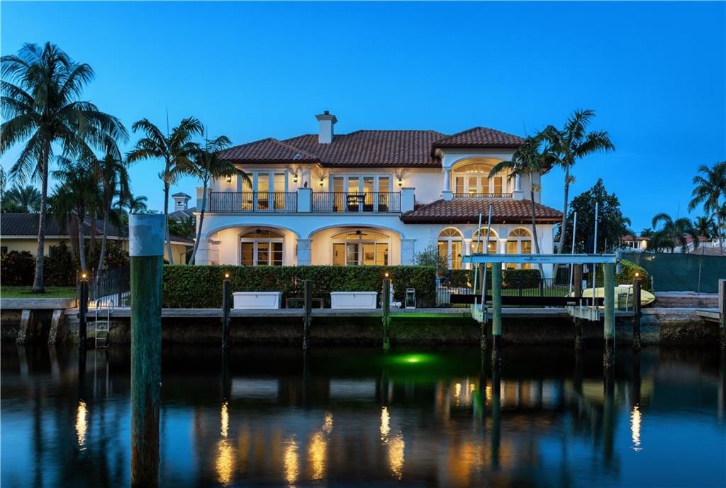 Spectacular Deepwater Estate on 80’+/- of waterfrontage only 2 lots off the intracoastal waterway. Timeless architecture reveals 5 bedrooms which include the waterfront den, 4.1 baths and 6,040+/- Total SqFt. Created in 2012 with remarkable detailing and craftsmanship throughout, this estate features an array of amenities including light-filled interiors, impressive two-story foyer, formal living room w/fireplace, & gourmet chef’s kitchen with onyx & Caesarstone countertops. Impressive 2nd level primary suite w/waterfront balcony, spa-like bath and walk in closets. Outdoor entertainment is enjoyed in the large covered loggia with summer kitchen. Resort-style pool with spill over spa & additional yard space for pets. 70' yacht dock with 16,000lbs+/-  boat lift minutes to the Hillsboro Inlet DISCLAIMER: Information published or otherwise provided by the listing company and its representatives including but not limited to prices, measurements, square footages, lot sizes, calculations, statistics, and videos are deemed reliable but are not guaranteed and are subject to errors, omissions or changes without notice. All such information should be independently verified by any prospective purchaser or seller. Parties should perform their own due diligence to verify such information prior to a sale or listing. Listing company expressly disclaims any warranty or representation regarding such information. Prices published are either list price, sold price, and/or last asking price. The listing company participates in the Multiple Listing Service and IDX. The properties published as listed and sold are not necessarily exclusive to listing company and may be listed or have sold with other members of the Multiple Listing Service. Transactions where listing company represented both buyers and sellers are calculated as two sales. The listing company’s marketplace is all of the following: Vero Beach, Town of Orchid, Indian River Shores, Town of Palm Beach, West Palm Beach, Manalapan Beach, Point Manalapan, Hypoluxo Island, Ocean Ridge, Gulf Stream, Delray Beach, Highland Beach, Boca Raton, East Deerfield Beach, Hillsboro Beach, Hillsboro Shores, East Pompano Beach, Lighthouse Point, Sea Ranch Lakes and Fort Lauderdale. Cooperating brokers are advised that in the event of a Buyer default, no financial fee will be paid to a cooperating Broker on the Deposits retained by the Seller. No financial fee will be paid to any cooperating broker until title passes or upon actual commencement of a lease. Some affiliations may not be applicable to certain geographic areas. If your property is currently listed with another broker, please disregard any solicitation for services. Copyright 2023 by the listing company. All Rights Reserved.