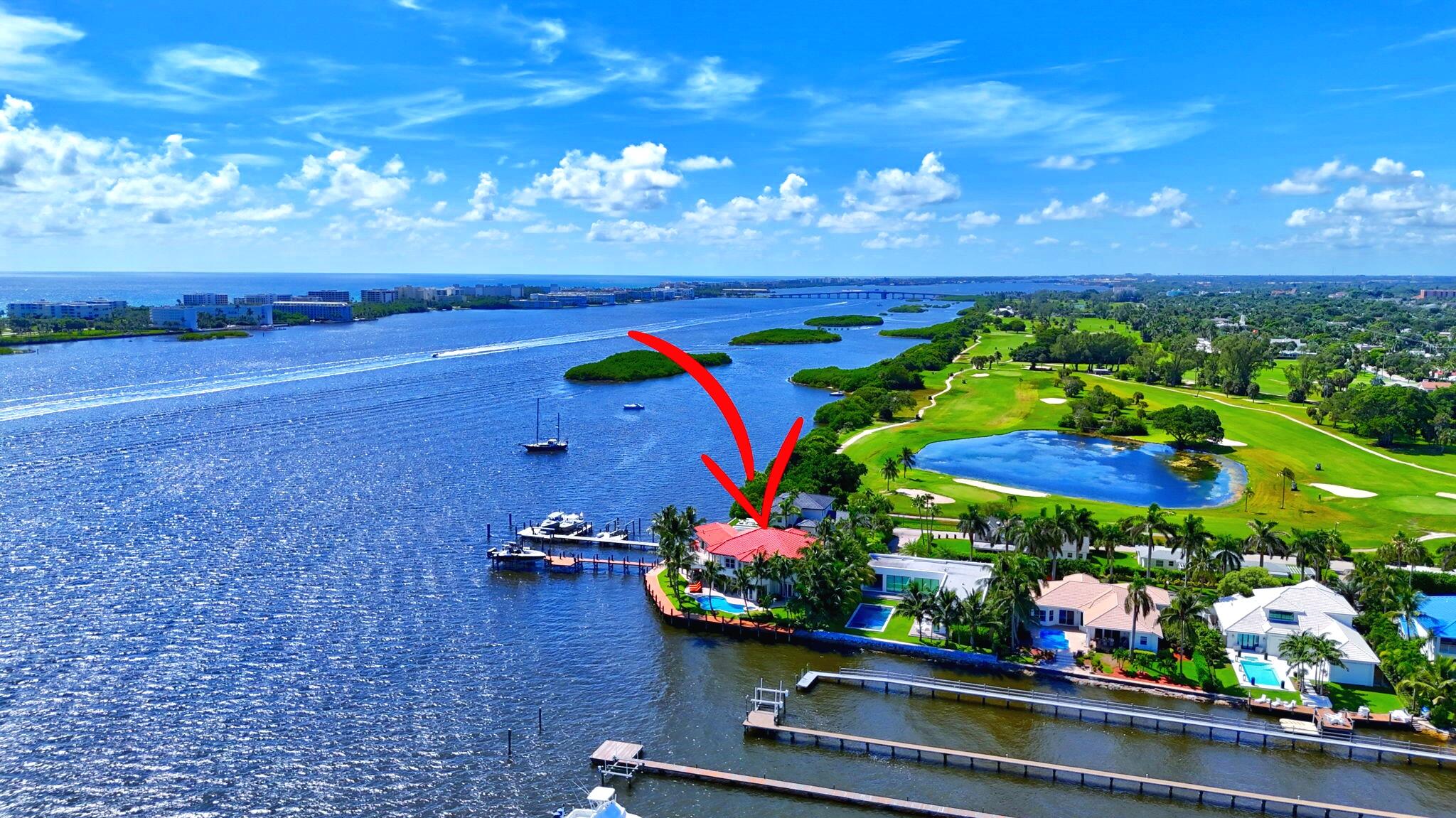 This Intracoastal estate offers an unparalleled blend of luxury, privacy, and convenience, set against the backdrop of breathtaking Intracoastal and Palm Beach Island views. Located in an exclusive gated enclave of 7 homes ensuring ultimate privacy and tranquility. 210' of direct intracoastal frontage, with a 210 ft. dock and two deep-water boat slips accommodating vessels up to 50 - 60ft. without obstructing views. Potential to expand private dock to accommodate an even larger yacht. Includes a boat lift and separate lift for jet skis. Northeast-facing in back with sweeping Intracoastal vistas, stunning sunrises, and refreshing breezes for perfect outdoor entertaining and relaxation.  Impressive living areas with soaring ceilings and impact windows that fill the home with natural light. Gourmet kitchen featuring an oversized island, custom cabinetry with intricate molding, and top-of-the-line appliances.  6 bedrooms and 5 bathrooms, including master suites on both the ground and upper floors. The master suite boasts double walk-in closets, a luxurious bathroom, an expansive wrap-around balcony, and a spiral stairwell leading to the patio, pool, and spa.  Additional Features: 3 car garage, Elevator, Brand new composite 210' dock , 4 new A/C units, newly resurfaced pool w/updated equipment, marble floors throughout, Crestron System for audio lighting and climate control, Hunter Douglas custom blinds, furniture negotiable.  Close to world-class dining and shopping on Palm Beach Island and Worth Ave.  Lake Worth Beach Golf Club steps from property and The Park West Palm (PGA style course-5 minute drive). 10 minutes to downtown West Palm Beach, Rosemary Square, Clematis Street and PBI Airport.  Schedule a showing today to experience the serenity and sophistication of this unparalleled estate.
