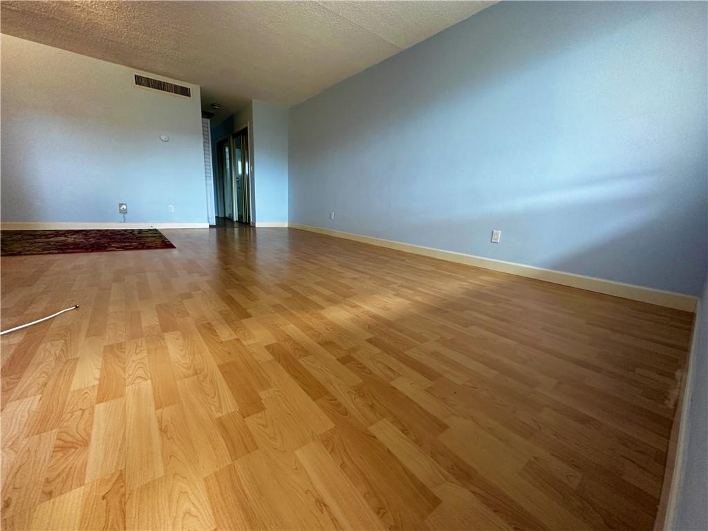 Clean, just repainted, and ready to move in 1/1 condo for sale in a premium location. IT CAN BE RENTED IMMEDIATELY. This spacious condo unit features a large living/dining room area, a large master bedroom with a very large walk-in closet, and much more. The condo complex is within 5 min walking distance of the beach, 150 feet from the intercoastal, and just steps away from restaurants and shopping. Unit features impact windows throughout, laminate and tile floors, two years old A/C, assigned parking, and very large separate storage. Community laundry rooms on each floor are just a step away from the entrance door. Whether you're looking for a primary residence, investment property, or the perfect beach getaway, this is the unit for you. Low maintenance fee. 25% Down required if financing.