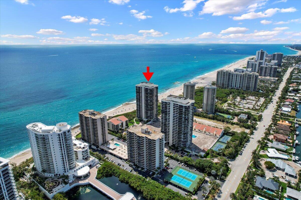 Experience luxury coastal living in this fully furnished, turnkey 2-bedroom, 2.5-bath southwest corner residence at the prestigious Martinique II on Singer Island. One of only four residences per floor, this exceptional 20th-floor home features a private double-door entry and over 2,000 square feet of living space with breathtaking panoramic views of the Atlantic Ocean, Intracoastal Waterway, and spectacular sunset skies. The spacious split-bedroom floor plan offers privacy and comfort, featuring a large primary suite with walk-in closets, a private balcony, and a luxurious bath. Floor-to-ceiling impact glass windows and doors showcase stunning water views from every room, while Somfy motorized shades provide convenience and elegance throughout. The open-concept kitchen is equipped with  premium appliances, including a 48-inch Liebherr refrigerator and double freezer, wine refrigerator, Miele dishwasher, and Bosch cooktop and oven. Additional features include a full-size washer and dryer, powder room, and two assigned garage parking spaces.  The expansive wraparound balcony extends from the Intracoastal side around the south-facing exposure to the ocean, creating the perfect setting for outdoor entertaining and enjoying both sunrise and sunset views.  Martinique offers an unmatched resort-style lifestyle with 900 feet of pristine beachfront and exceptional amenities, including direct beach access with full beach service, concierge, 24-hour manned gate security, two heated pools, fitness center, tennis and pickleball courts, hot tub, billiards room, BBQ areas, and The the community's private restaurant. The newly renovated amenity deck and pool area are expected to be available for the 2026-2027 season.  Available furnished for annual lease at $7,500 per month or seasonal lease (3-month minimum) at $9,000 per month. Enjoy the best of Singer Island beachfront living in one of the area's most sought-after luxury communities.
