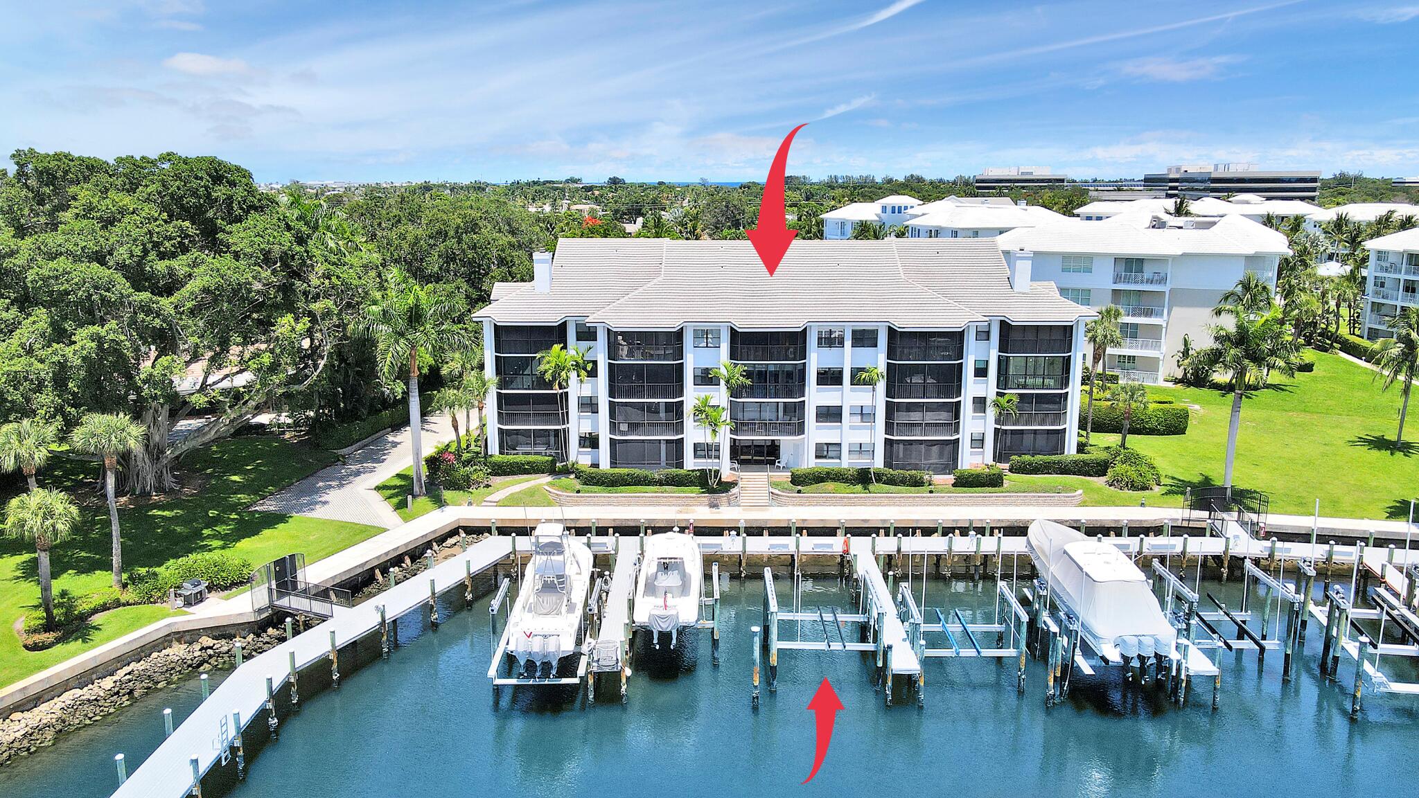 Live the Ultimate Boating Lifestyle in Juno Beach!Top-floor 3BR/2BA condo in the exclusive waterfront community of Bay Colony. This beautifully maintained unit offers direct Intracoastal & marina views, a private 51' deeded boat slip with a new 24,000lb lift, & no fixed bridges—perfect for boaters! Features include vaulted ceilings, 4 sliding glass doors showcasing amazing sunset views, a spiral staircase leading to a loft/flex space/3rd bedroom, hardwood flooring, tile in the primary suite, & stainless steel appliances in the open kitchen. Enjoy resort-style amenities: 2 marinas, saltwater pool, hot tub, gym, clubhouse, tennis & pickleball courts, bocce ball & more. Just minutes to Juno Beach & pier, shopping, restaurants, & easy highway access. Pet & rental friendly!