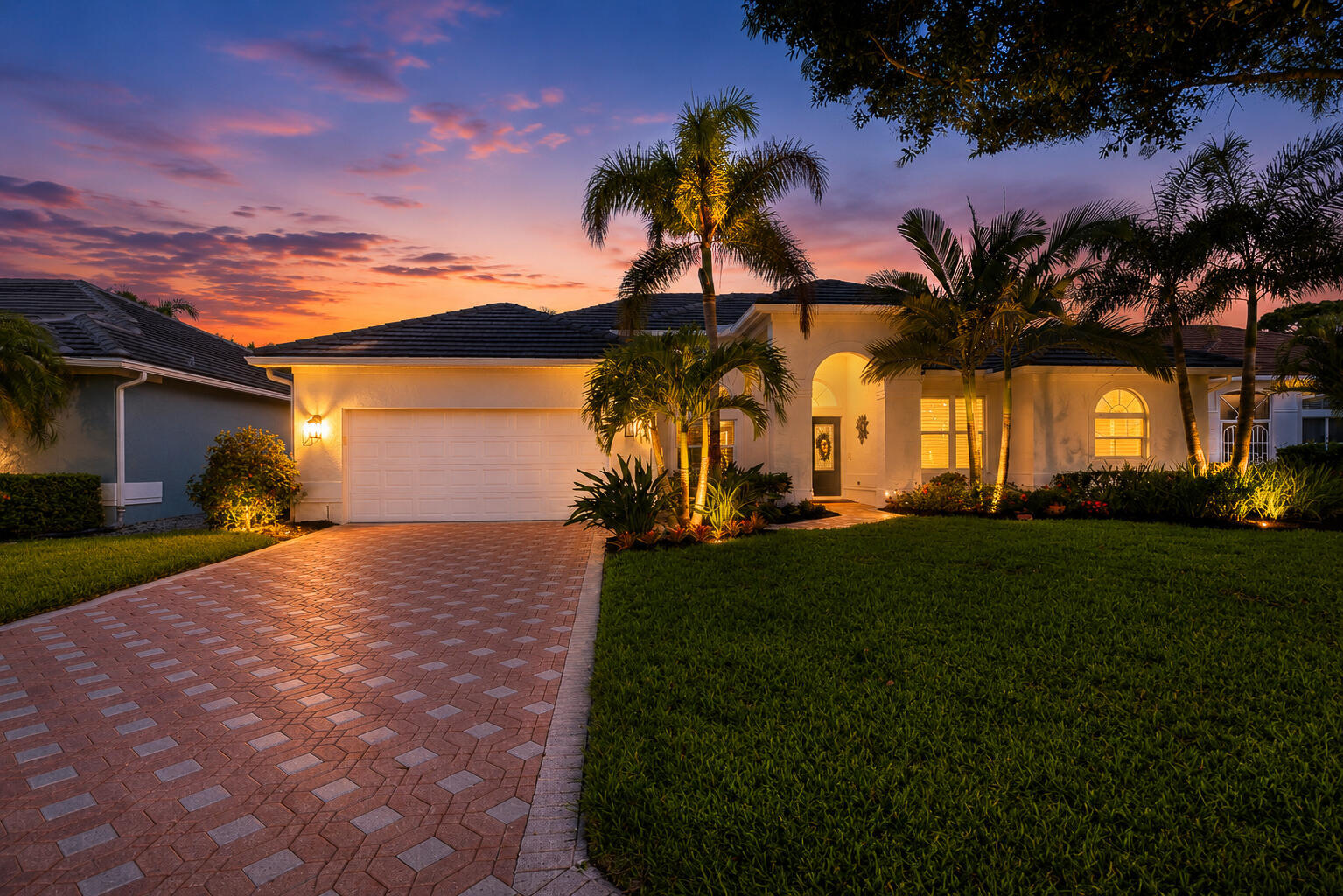 100% Move-In Ready!  Beautifully updated and bright Monarch Country Club home that shows like new. This Florida living home features 12-foot ceilings, plank tile flooring throughout, and an abundance of natural light.   Extensive updates include a 2019 roof, beautifully renovated kitchen with pull-out shelving, three updated bathrooms, 2023 impact windows and doors, 2023 hurricane-rated garage doors, a 2026 water heater, and fresh neutral interior and exterior paint just completed in 2026.  The spacious primary suite opens directly to the lanai through sliding glass doors. Two additional guest bedrooms—one with an en-suite bath—plus a dedicated office provide plenty of room for family and guests. Plantation shutters throughout, epoxy-coated garage and lanai floors, and  a two-car garage with a separate golf cart bay add to the home's exceptional appeal.  Outside, enjoy peaceful golf course views with no cart path behind the home. The oversized lanai is designed for year-round enjoyment, with the roof covering approximately half the space for shade and protection from the elements. There's ample room to add a pool, and the updated cabana bath is already in place.  The pristine, newly painted interior is truly move-in ready—just bring your artwork and make it your own. Social and golf memberships are optional. HOA includes live 24/7 gate house security, cable & internet package, landscaping, exterior house painting every 6 years, roof & house power washing every other year.  Newer hot tub and furnishings are negotiable, offering the opportunity to purchase the home turnkey.  Major updates have already been completed. All that's left to do is move in, relax, and enjoy the Monarch Country Club lifestyle.  Note:  Current owner's annual homeowners insurance premium is approximately $3,000. Flood insurance is not currently required. Insurance premiums vary based on carrier, coverage, buyer qualifications, and other factors. Buyers should obtain their own insurance quote