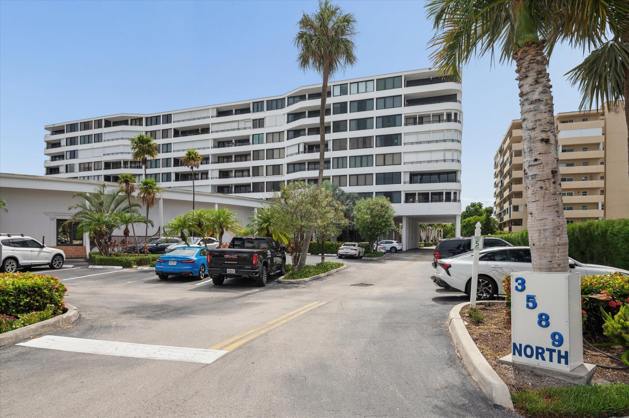 Welcome to Mayfair House in South Palm Beach, where coastal living meets convenience. This beautifully renovated 1 bedroom, 2 full bathroom townhome offers 922 sq ft of thoughtfully designed living space with dramatic volume ceilings and an open, inviting floor plan. The residence features a spacious living/dining area, an updated open concept kitchen, and impact windows and doors that open to a private lanai overlooking tropical grounds and partial lagoon. The versatile layout includes two full bathrooms, a separate laundry room, and an upstairs primary suite with generous closet space. Enjoy year round Florida living with private deeded beach access directly across the street, complete with a beachfront sundeck, gazebo, and BBQ area. Mayfair House residents enjoy a variety of amenities,  including two heated pools, a fitness center, sauna, community room, observation deck, bike storage, car wash area, 24-hour doorman service, and assigned parking conveniently located just outside your door. Ideally located within walking distance to shops, restaurants, and the renowned Eau Palm Beach Resort & Spa, this property is perfect as a primary residence, seasonal getaway, or investment opportunity. Experience the best of South Palm Beach living just steps from the beach.