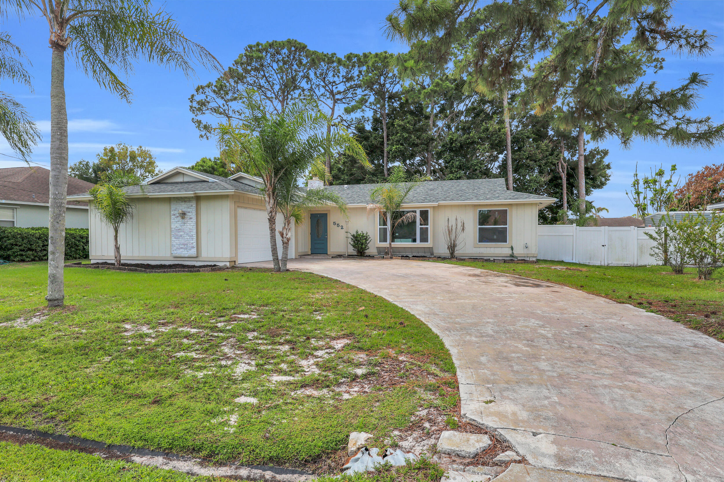Beautifully updated 3BR/2BA home featuring a spacious open floor plan and modern finishes throughout! Completely remodeled in 2022, this move-in ready property also features a 2022 roof, impact glass windows throughout, and a hurricane-rated garage door for added peace of mind. Interior highlights include oversized porcelain tile flooring, a remodeled kitchen with large center island, white shaker cabinetry, stainless steel appliances, and abundant counter space perfect for entertaining. Split bedroom layout provides privacy, while the bright living and dining areas create an inviting atmosphere. Additional features include a 2-car garage with an air-conditioned workshop, a covered patio, a fully fenced backyard, a walk-in closet, and a wood-burning fireplace.