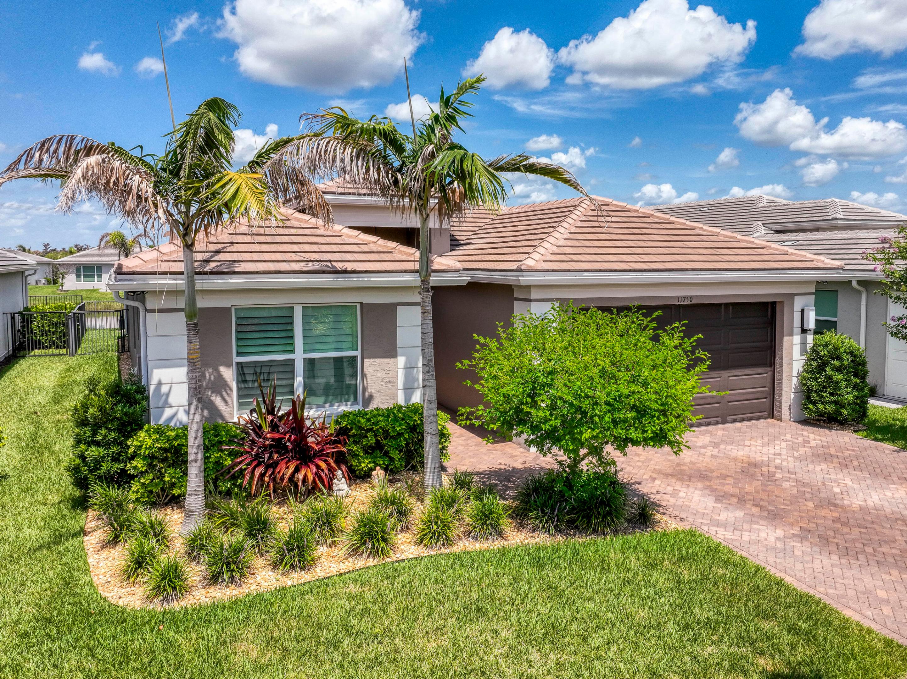 Beautifully upgraded 2023 Bimini Model lakefront home featuring 3 bedrooms, 3 full bathrooms, plus a spacious private den perfect for a home office, media room or flex space. Premium upgrades include luxury vinyl plank flooring throughout, plantation shutters, custom closet systems, framed bathroom mirrors, epoxy garage flooring, aluminum fenced backyard, and roll-down privacy screens on the covered lanai. The open-concept layout is filled with natural light and overlooks tranquil lake views. Located in the sought-after Riverland community with exceptional resort-style amenities, this move-in ready home offers luxury, flexibility, and an outstanding lifestyle.