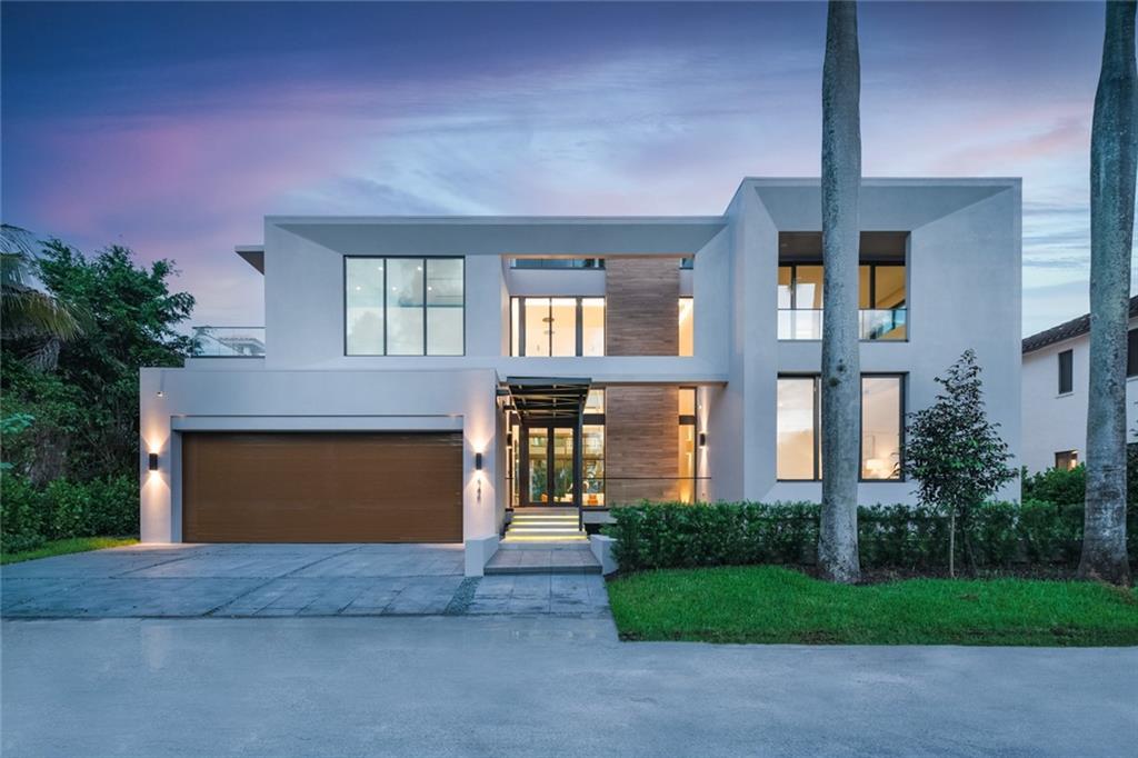 ULTRA MODERN WATERFRONT HOME IN LAS OLAS ISLE! This luxurious home features 100-feet of waterfront on deep water canal access with a new seawall & concrete dock. This estate features 6 beds, 6 full baths, 2 HB, along with a 3-car garage (convertible to 5) 6,430 SF under air. Offering a convenient first-floor VIP suite. Oversized Italian tile flooring throughout, and a pool-facing living area with floor-to ceiling windows. Ideal for waterfront living and entertaining guests, an east-facing waterfront pool, an outdoor summer kitchen, and a 900 SF private, covered rooftop terrace with a jacuzzi (reachable by elevator) and downtown views.The house features a modern gourmet kitchen, outfitted with Cesar Italian cabinetry, a Wolf double oven, a Subzero refrigerator, and oversized kitchen island. A shining star of architectural elegance on Las Olas Isles, modern minimalism combines with natural elements creating a warm inviting home that uniquely blends indoor and outdoor living and invites your mind, body and soul to soar to new heights. Voluminous ceilings are showcased the moment you arrive, visible from the outside and drawing your eye to an immense wall of windows looking out to the sparkling pool and waterfront. Water elements are integrated into the design in the front and back of the property. Rooftop terrace features summer kitchen and covered entertaining area. European modern kitchen features large entertaining island. Floating staircase is a focal point near the entry, like a revered piece of art. Master Suite Features his and her walk in closets & massive master bath.