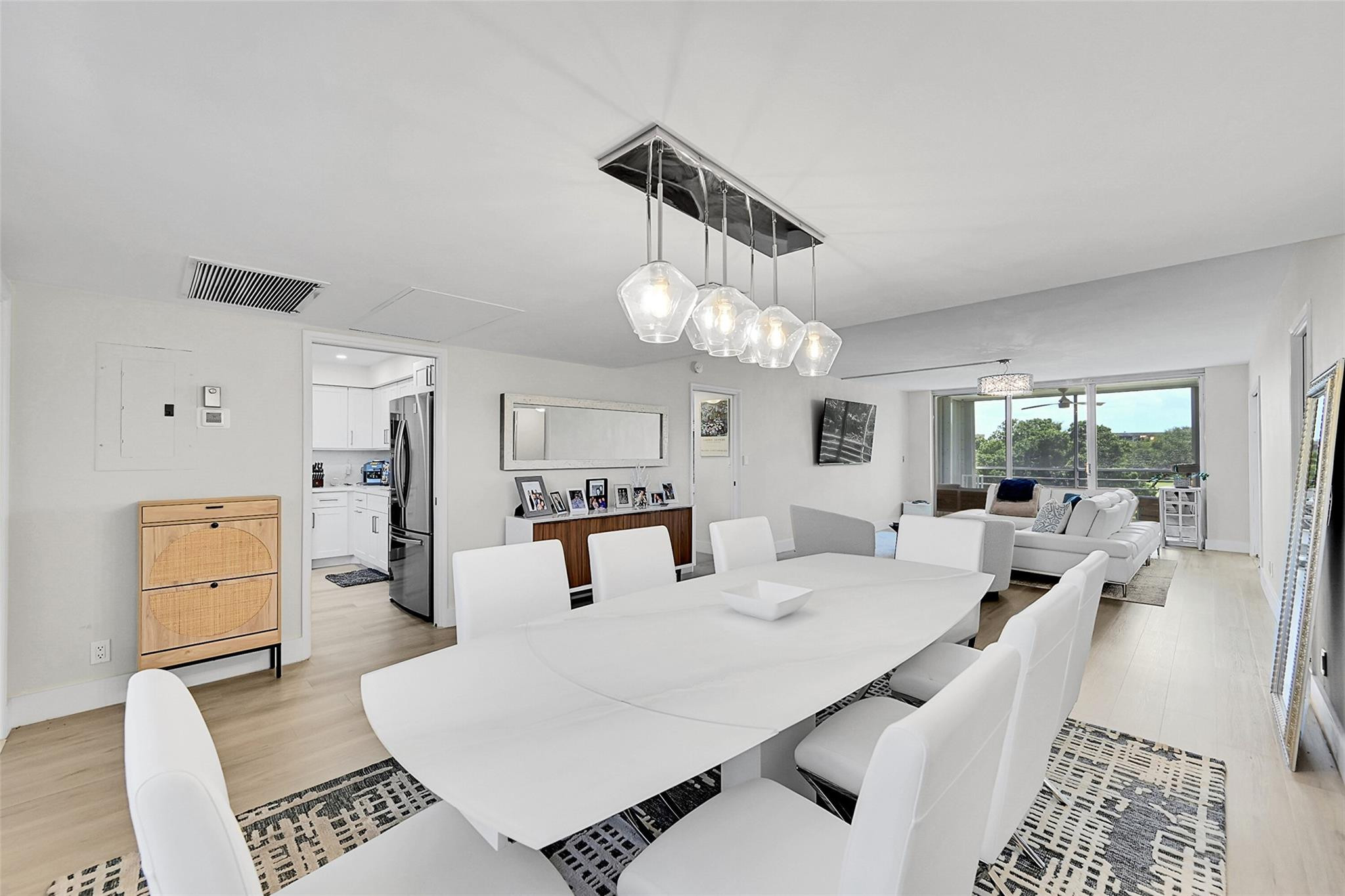 Welcome to this 3-bedroom, 2-bathroom beautifully updated condo situated in the Palm-Aire Country Club community in Pompano Beach. With 1,500 square feet of light & bright modern living space, this property offers the privacy of a split floor plan with breathtaking views of the golf course and lagoon. Relax and enjoy the vista from the screened balcony. Elegant, spacious and functional kitchen with SS appliances, white shaker cabinets, quartz countertops and backsplash. Full sized LG washer & dryer in unit. Located within an established community, residents enjoy an array of amenities, including golf, tennis, pools, and playgrounds. Secure building entry, fob or phone access to elevator, dedicated parking and plenty of guest parking. Plenty of closets, each built out for maximum storage. Updated and modern recessed lighting, vinyl plank flooring and ceiling fans throughout. Remote controlled privacy blinds in all bedrooms. 2 community swimming pools, one heated, shuffleboard & barbecues, 3 golf courses, 2 practice ranges, play lot, tennis. Many conveniences nearby incl. easy access to I-95 and turnpike, grocery stores, restaurants. Only a few miles to the beach! All information on MLS & Matrix For This Listing is Deemed Accurate & Not Guaranteed & Subject to Errors & Changes Without Notice