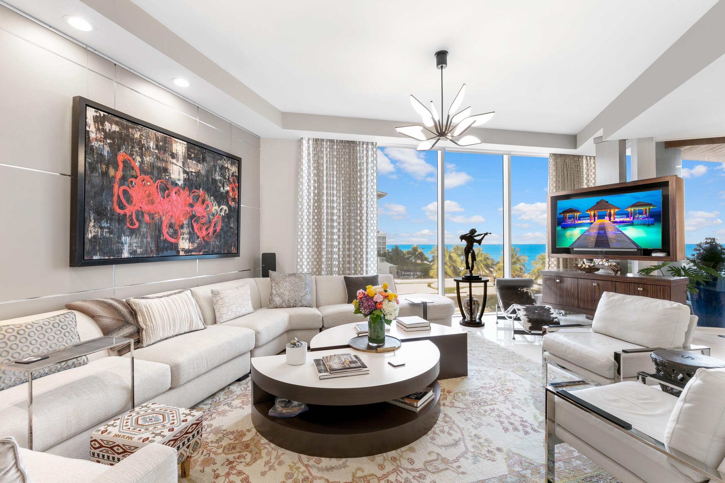The majestic allure of One Thousand Ocean, the most coveted waterfront address in Boca Raton unveils its newest listing on the market - Residence 408. This designer finished and furnished condominium boasts 3,408 living SF and features 3 bedrooms, 3 and one-half baths, custom office, wine display wall and 3 private terraces. Unique to any oceanfront building in Boca Raton are the 10ft ceiling heights and floor-to-ceiling glass windows which allow for an abundance of natural light to beautifully illuminate the chic spaces. The spacious terraces overlook the ocean and mouth of the Inlet - which allows for the enjoyment of both sunrises and sunsets. The oceanfront terrace includes a full summer kitchen, plunge pool and outdoor furnishings. Private elevator landing and 2 car garage complete this offering. One Thousand Ocean residents also have access to an array of luxury amenities including 24/7 security, concierge services, a state-of-the-art fitness center, spa and sauna, a resort-style pool and cabanas, and much more.