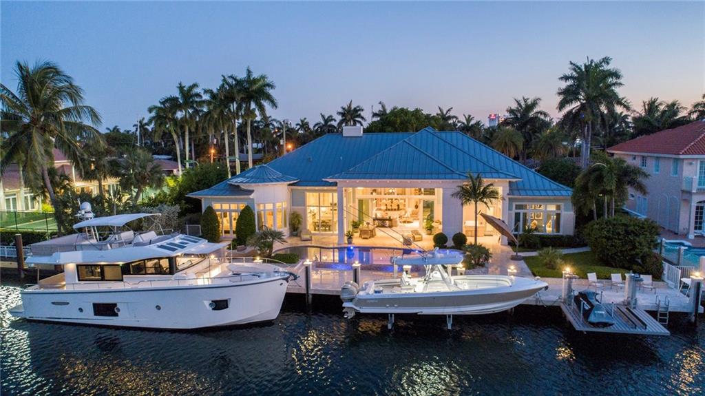 The Hampton’s meets Harbor Beach. Chic, Coastal-inspired Deepwater Estate. This single-story custom estate is sited on 120’+/- of waterfrontage in Fort Lauderdale's most desirable waterfront setting. Soaring, high-volume ceilings give way to the open and light-filled interiors with window walls of glass. A custom designer kitchen features stainless steel appliances, gas range, custom cabinets and adjacent breakfast table with floor to ceiling windows. Grand master suite features intricate ceiling and wall details along with separate sitting area. Private guest wing with three bedrooms and a garden front office. Outdoor resort entertainment at the expansive pool w/sun shelf and a 12-person spill-over spa. 120’+/- concrete yacht dock capable of hosting up to 100’+/- vessel DISCLAIMER: Information published or otherwise provided by the listing company and its representatives including but not limited to prices, measurements, square footages, lot sizes, calculations and statistics are deemed reliable but are not guaranteed and are subject to errors, omissions or changes without notice. All such information should be independently verified by any prospective purchaser or seller. Parties should perform their own due diligence to verify such information prior to a sale or listing. Listing company expressly disclaims any warranty or representation regarding such information. Prices published are either list price, sold price, and/or last asking price. The listing company participates in the Multiple Listing Service and IDX. The properties published as listed and sold are not necessarily exclusive to listing company and may be listed or have sold with other members of the Multiple Listing Service. Transactions where listing company represented both buyers and sellers are calculated as two sales. The listing company’s marketplace is all of the following: Vero Beach, Town of Orchid, Indian River Shores, Town of Palm Beach, West Palm Beach, Manalapan Beach, Point Manalapan, Hypoluxo Island, Ocean Ridge, Gulf Stream, Delray Beach, Highland Beach, Boca Raton, East Deerfield Beach, Hillsboro Beach, Hillsboro Shores, East Pompano Beach, Lighthouse Point, Sea Ranch Lakes and Fort Lauderdale. Cooperating brokers are advised that in the event of a Buyer default, no commission will be paid to a cooperating Broker on the Deposits retained by the Seller. No commissions are paid to any cooperating broker until title passes or upon actual commencement of a lease. Some affiliations may not be applicable to certain geographic areas. If your property is currently listed with another broker, please disregard any solicitation for services. Copyright 2020 listing company All Rights Reserved.