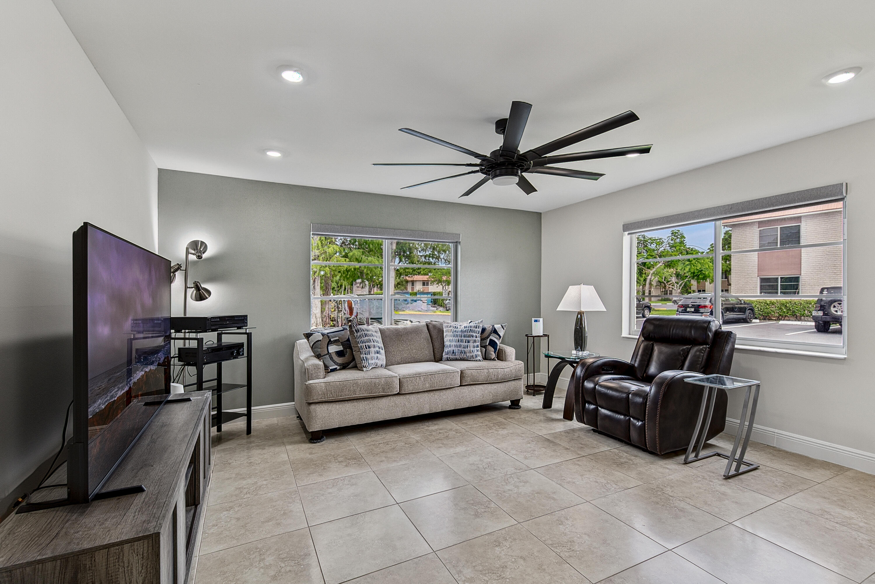 Welcome home to this beautifully renovated, spacious 1,180 sq/ft 2BR/2BA first-floor corner unit condo, just steps from vibrant Wilton Drive! Enjoy a modern kitchen, tiled floors, dimmable recessed lighting, impact windows, huge modern ceiling fans and electric shades throughout and extra blackout shades in the bedrooms. Updated baths, a walk-in closet, and a newer hot water heater. Relax at the heated pool, host friends at the renovated clubhouse with kitchen, BBQ area, billiards, and ping pong tables, or unwind in the sauna. Secured entrance with assigned parking just steps away. New roof! Great for investors—rent immediately (1-yr min lease, no Airbnb). Cats welcome, sorry no dogs. A fantastic opportunity in the heart of Wilton Manors!