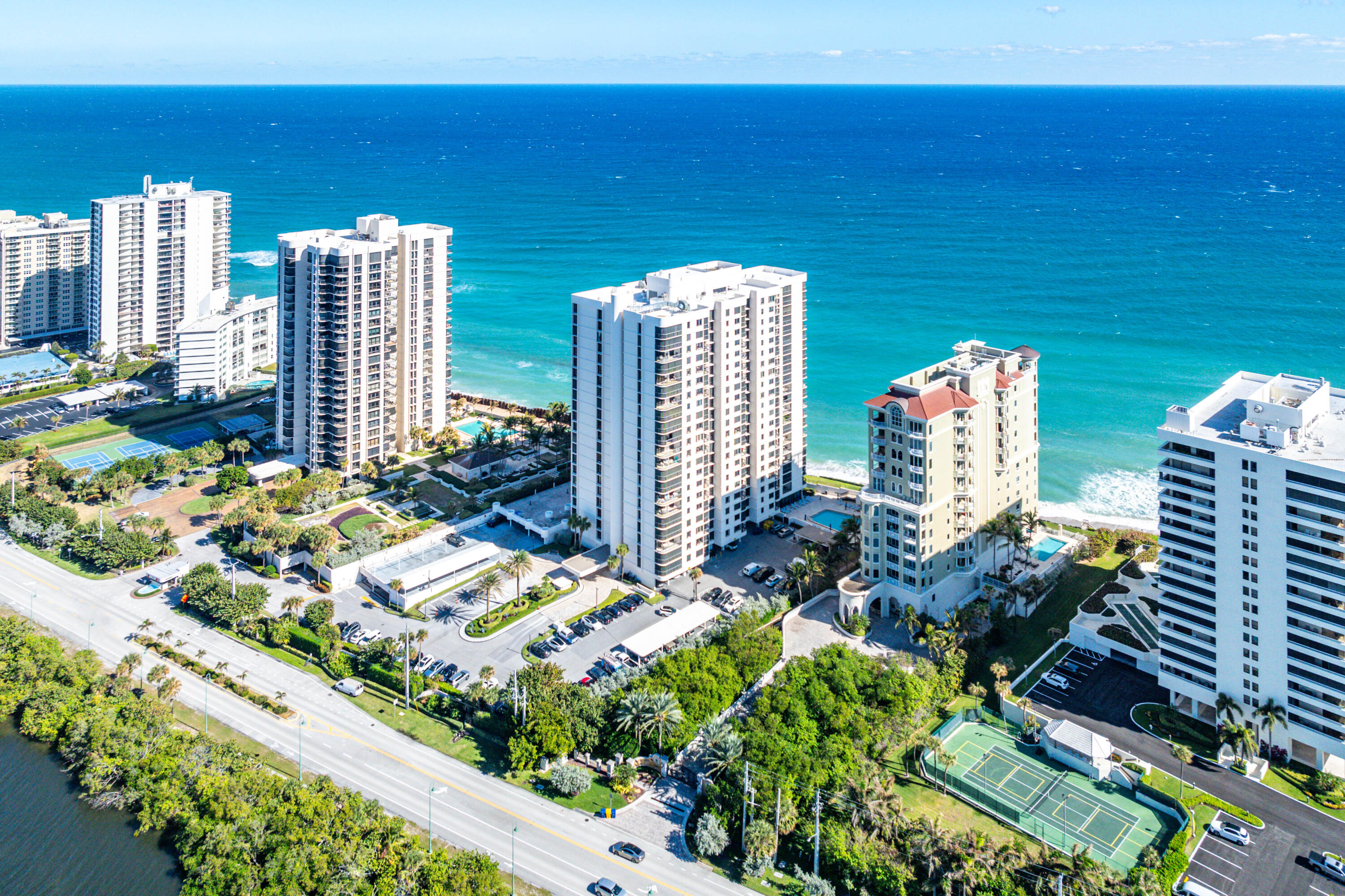 Nestled on the north end of highly desirable Singer Island, this 1,295 sf,2-bedroom, 2-bath condo is in the coveted Eastpointe building with direct views of both the Ocean and Intracoastal. See city lights, and the moonlit Atlantic at night. Boasting marble floors throughout this newly updated unit is move-in ready for those who appreciate a luxury building which features picture-perfect views. The Primary bedroom has ocean views and a large balcony, and the second bedroom has ocean views as well as beautiful Intracoastal views. Other amenities include 24-hour manned gate and front desk, assigned garage parking and personal secure storage right outside your front door.   Beautiful, manicured grounds,24-hour security at gate and front desk, gym, pool, social room, game room with a pool table. spectacular vistas of the Ocean & Intracoastal. Check out both the stunning SUNRISE AND SUNSET from your private balcony!