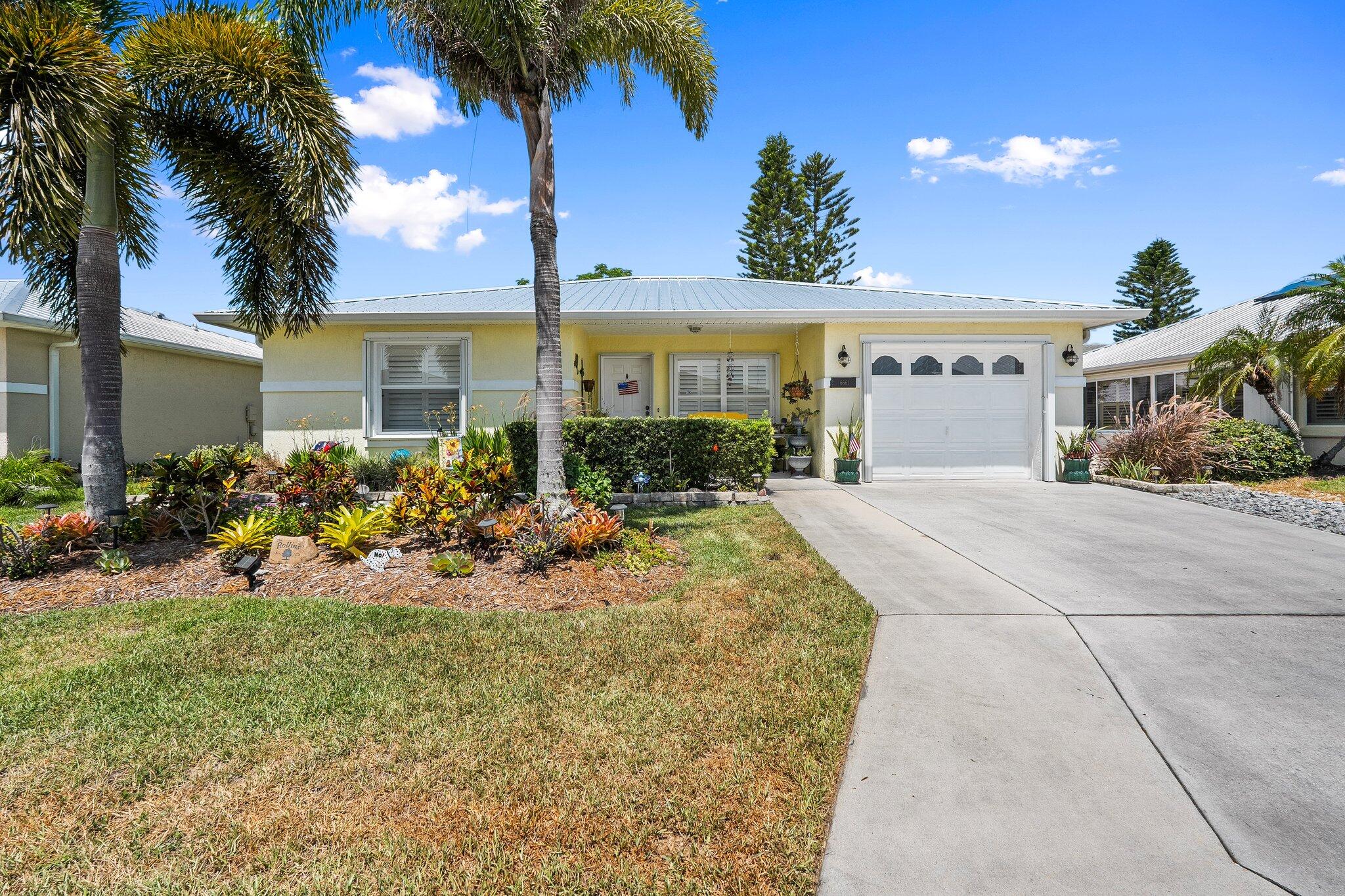 Located in the Active 55+ community of Spanish Lakes Fairways. This CBS two bedroom, two bath home features wood laminate flooring and plantation shutters throughout. Metal roof and accordion hurricane shutters is an added bonus! 
Land lease fee not only includes access to FREE golf and lawn service there are numerous other activities to enjoy! Spanish Lakes Fairways is within a few short minutes of  shopping, restaurants, banks and churches.