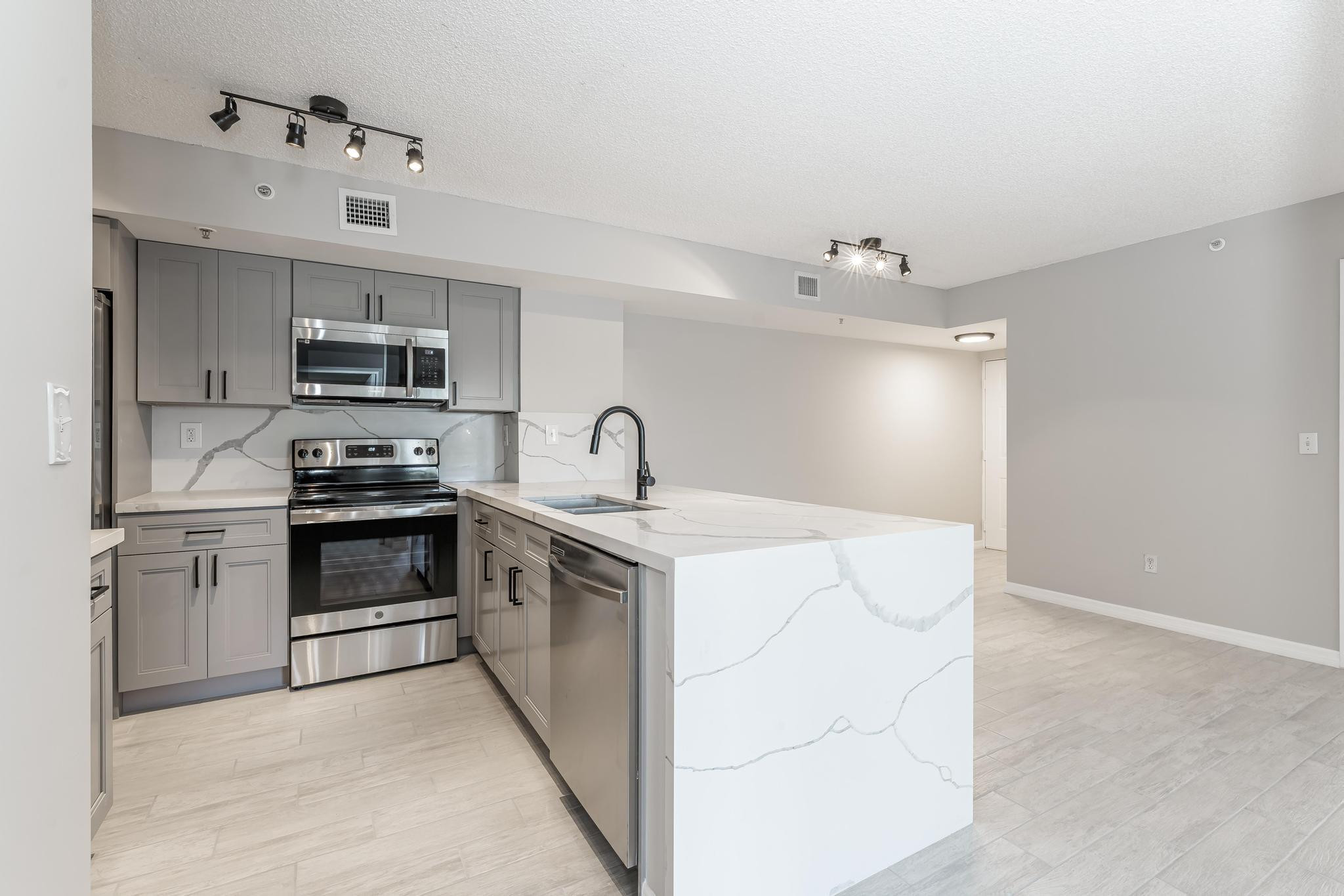 LOCATION, LOCATION, LOCATION!!! In the heart of Davie close to shops, restaurants, highways and Walking distance to NSU! Beautiful Lake View 2/2 Condo with nice open layout and huge patio on the second floor in Royal Grand Condominiums. The unit has been gut renovated - completely remodeled with flooring, paint, kitchen and bathrooms!  The entire community has been completely redone.  New roof, fresh paint, workout facility, pool redone, racquetball, pool room, business center, tennis and basketball.  Do not miss this tremendous opportunity to own one of the nicest units in the community! Tenant is moving out at the end of July 2026.