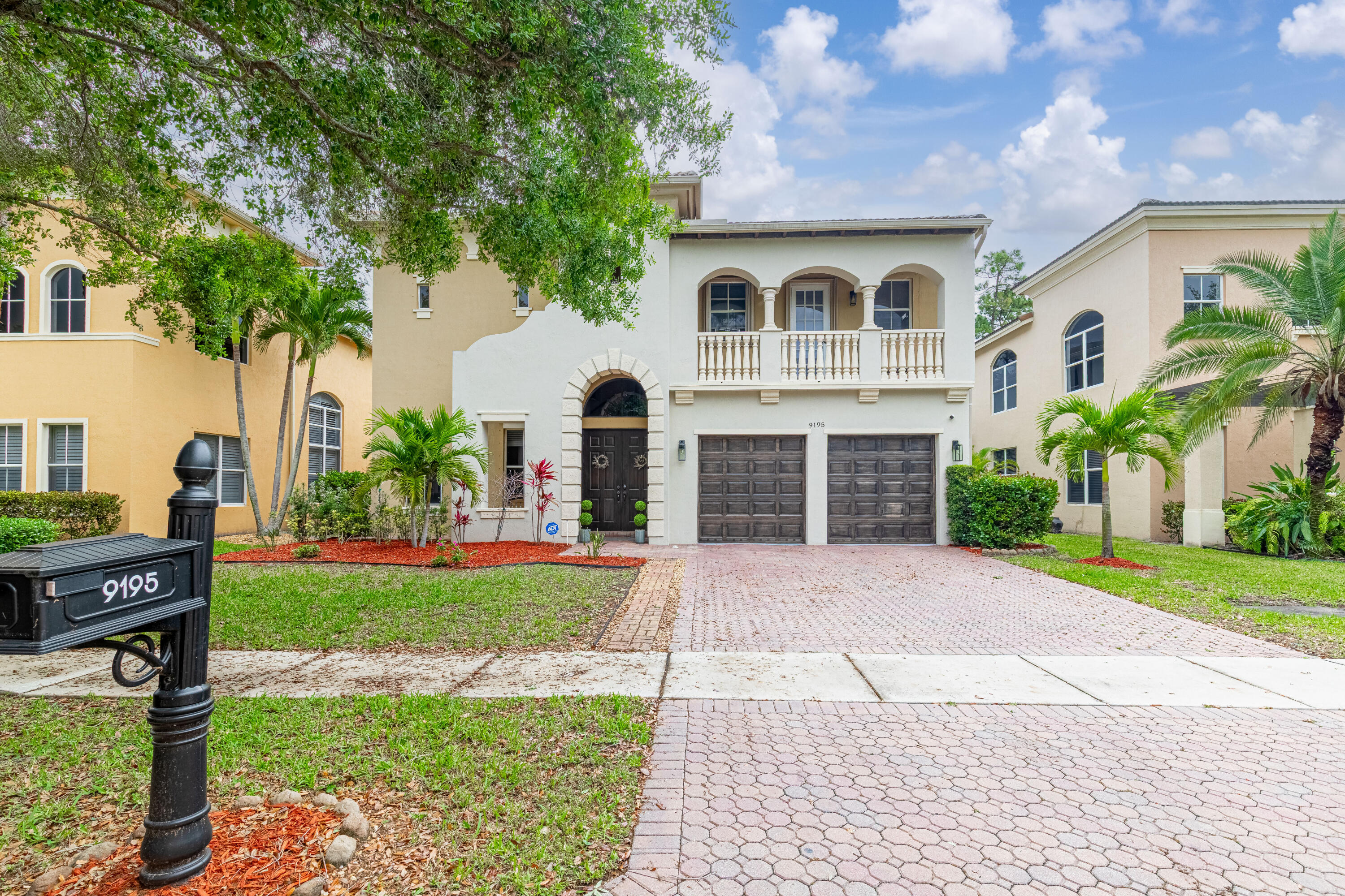 Welcome to Worthington Estates, an exclusive gated enclave of just 81 residences, ideally situated off West Okeechobee Boulevard in the heart of West Palm Beach. This private and picturesque community offers a rare blend of tranquility and convenience.  This exceptional estate boasts approximately 4,500 square feet under air and makes a striking first impression with a grand, designer-inspired entry featuring a sweeping custom staircase and dazzling crystal chandeliers.   Thoughtfully designed for both refined entertaining and comfortable everyday living, this five-bedroom, office, and media room, four-and-a-half-bath residence offers an expansive and versatile layout. The main level showcases a luxurious primary suite, along with an additional oversized room perfect for a home office, guest suite, or playroom.  Formal living and dining spaces are complemented by soaring ceilings, while the open-concept kitchen seamlessly flows into the family room, creating an ideal gathering space. A substantial bonus room—perfect as a private media lounge or game room—features its own half cabana bath. Elegant crown molding throughout enhances the home's sophisticated aesthetic.  Upstairs, a bright and spacious loft provides additional living space, accompanied by new plank-style tile flooring throughout. The second level offers a well-appointed guest suite at the front of the home with a private balcony, two additional centrally located bedrooms, and an extraordinary owner's retreat at the rear. This expansive suite features a separate sitting area or office, dual walk-in closets, a spa-caliber marble bathroom, and a private balcony overlooking the serene backyard.  Outdoors, discover your own resort-style retreat. A sparkling in-ground saltwater pool, expansive fenced-in patio, and lush tropical landscaping create an idyllic setting for both relaxation and upscale entertaining year-round.  A rare offering within a boutique community, this residence embodies the essence of luxury South Florida living. Private showings available by appointment.