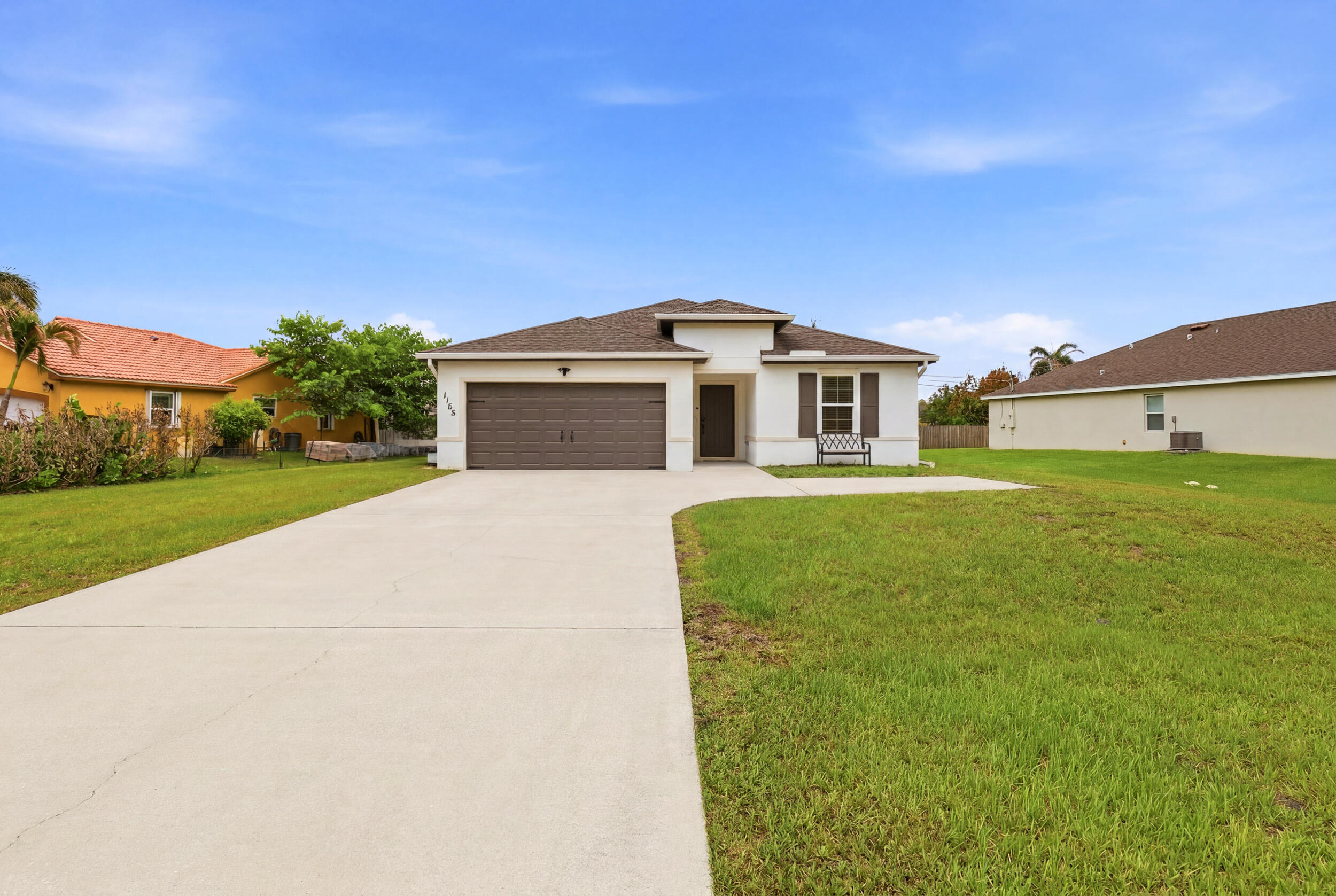 Custom-built in 2021, this flawless CBS residence delivers concrete block security, high architectural ceilings, and a smart split-floor plan designed entirely for modern privacy. The open-concept interior features seamless tile flooring throughout, a massive kitchen island, a walk-in pantry, and a dedicated indoor laundry room. Positioned on an expansive, oversized lot with absolutely NO HOA restrictions, the property gives you total freedom over your land. The backyard is FULLY enclosed by a wood privacy fence, offering a pristine blank canvas with ample room for a custom pool, while the massive driveway provides plenty of space for vehicles, boats, or golf cart parking. This pristine new build home is complete and ready for you!