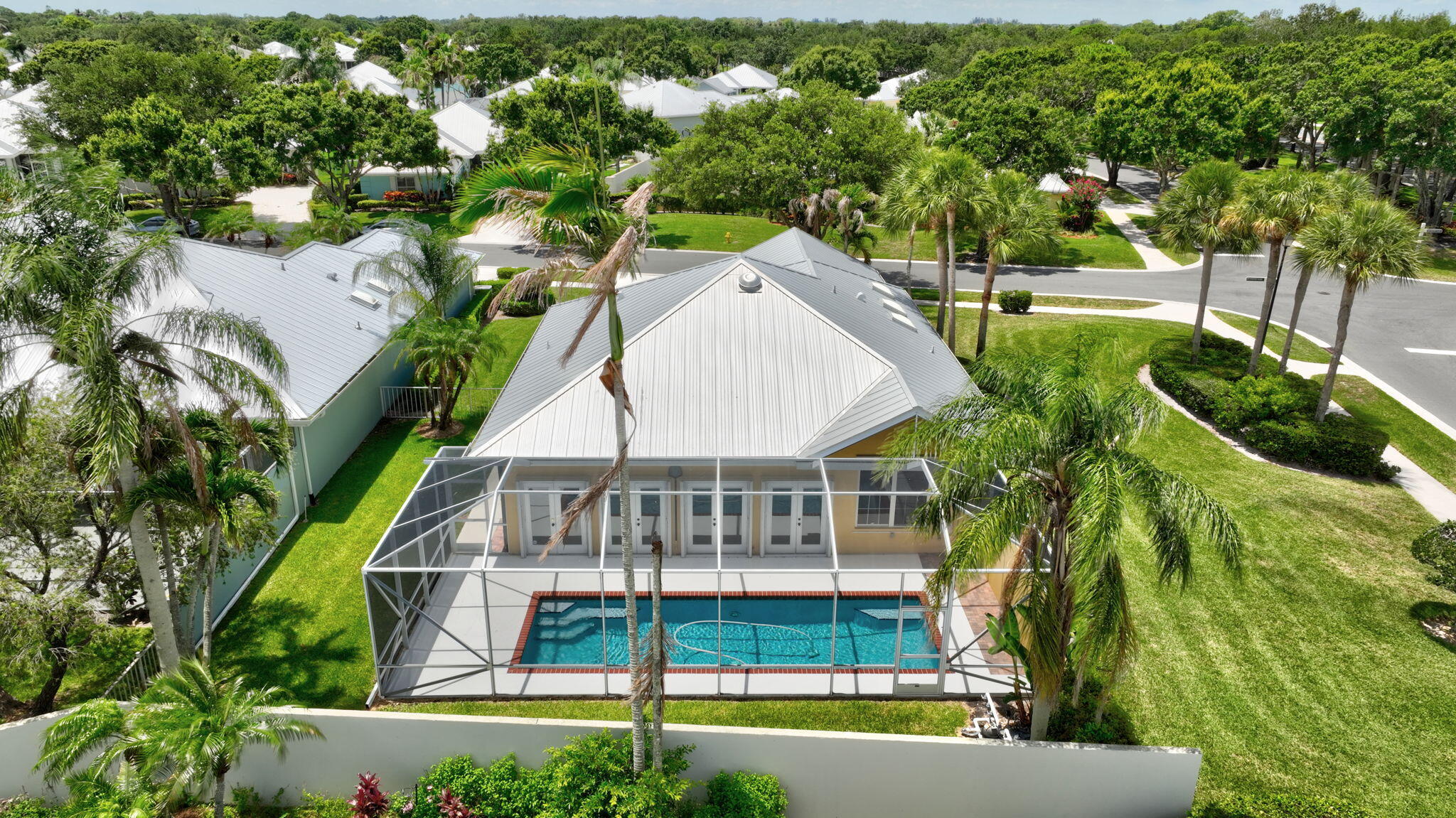 Welcome to this private single-story residence nestled in The Meadows at Martin Downs, a gated community in Palm City, FL. This thoughtfully designed home on a corner lot offers a private screened pool and comfortable living space with 3 bedrooms and 2 full bathrooms, providing ample room for various lifestyle needs. The efficient one-story layout eliminates the need for stairs while maintaining excellent functionality throughout. A two-car garage offers convenient parking and storage solutions. This single-family CBS home presents a solid foundation for those seeking a well-proportioned home in an established community with pool, kids playground and updated tennis & pickleball courts. Close to A-Rated schools, beaches, shopping, golf, I95, Turnpike, US1 & PBI Airport.