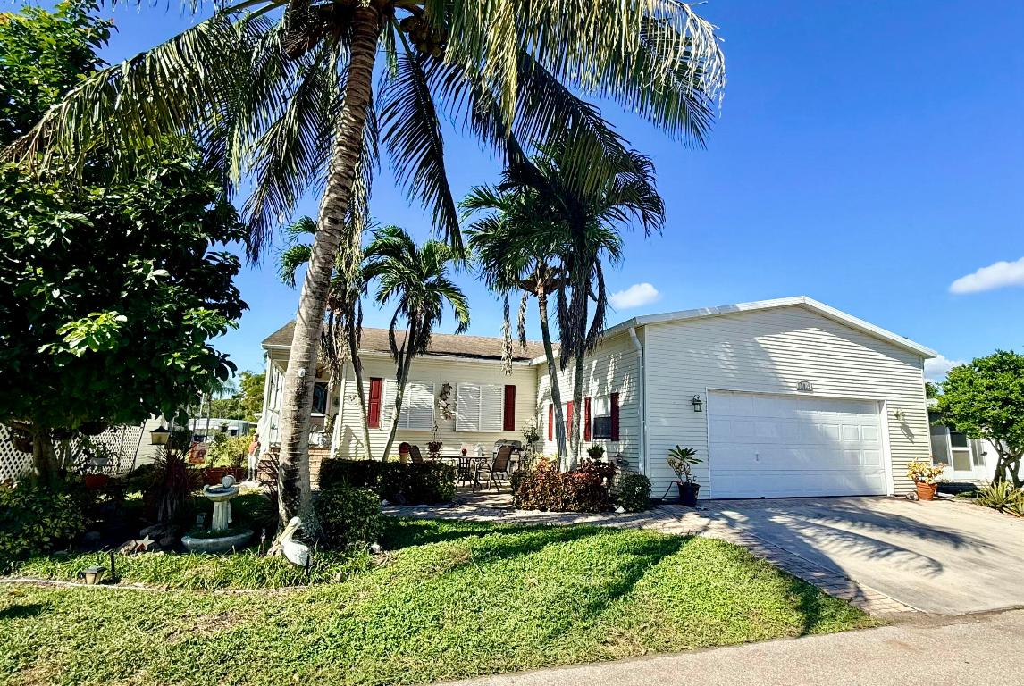 SELLER OFFERING 3 MONTHS PAID LOT RENT AT CLOSING! Welcome to this inviting 3-bedroom, 2-bath modular home featuring a rare 2-car garage and a spacious open-concept layout that blends the kitchen, living, and dining areas perfectly for everyday comfort and entertaining. The split floorplan offers excellent privacy, with a generous primary suite and well-sized guest rooms. The home comes partially furnished for added convenience, allowing buyers to move in with ease. Located in Maralago Cay, a gated 55+ community known for its friendly atmosphere and resort-style amenities, residents enjoy two heated pools, a clubhouse, fitness center, organized activities, and beautifully maintained grounds. Your Florida lifestyle begins here--schedule your private showing today! Lot rent of 1396.35/month
