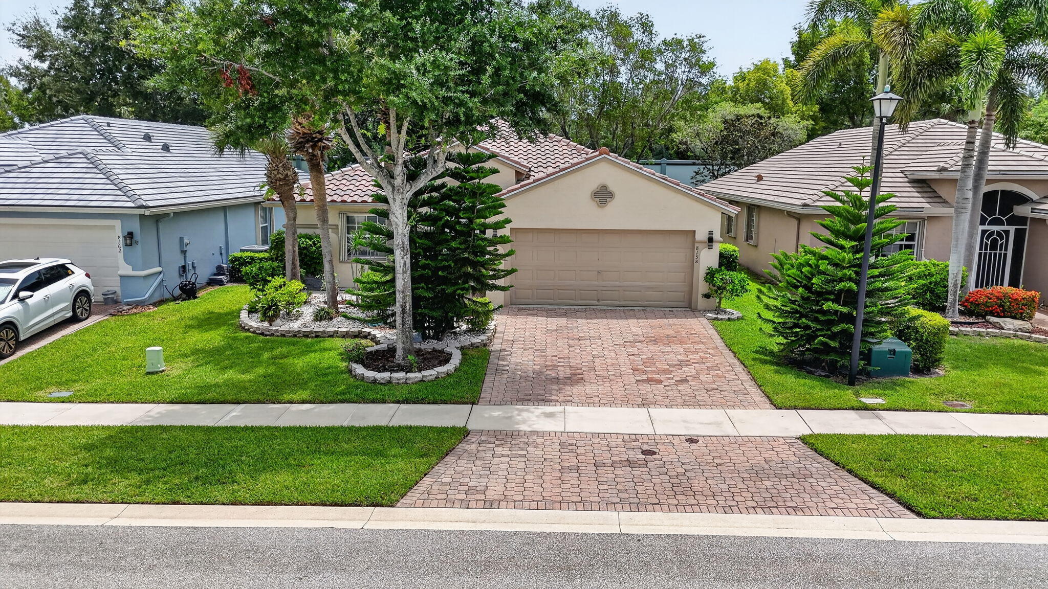 Welcome to this beautifully updated 3-bedroom, 2-bathroom home with a 2-car garage in the desirable 55+ community of Venetian Isles. Enjoy peace of mind with a brand-new 2026 roof, 2025 A/C, cabinetry, quartz countertops, stainless steel appliances, ceramic tile throughout, and a renovated guest bath. The screened patio features a beautiful deck and misting system, perfect for relaxing or entertaining. Venetian Isles offers resort-style living with a newly renovated 26,000 sq. ft. clubhouse, pools, pickleball, tennis, fitness center, restaurant, and endless social activities. HOA includes cable, internet, alarm monitoring, landscaping, common area maintenance, clubhouse amenities, on-site management, reserve funding, and a 24-hour guarded gate.