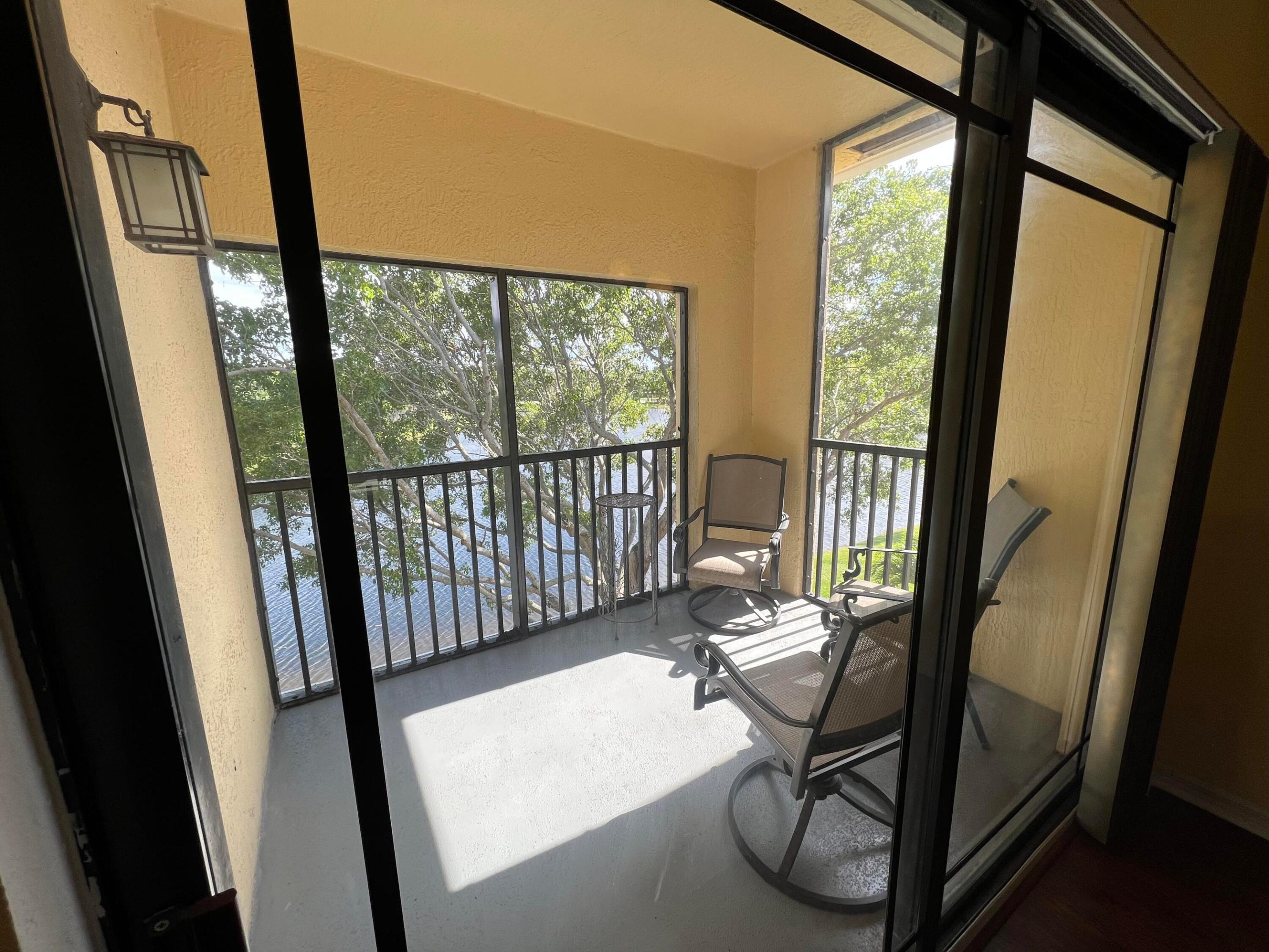 Water view! Third floor unit with hurricane impact glass!!! Updated kitchen and bathroom. Owner is installing new vinyl plank flooring and paint in neutral colors.  No carpet. Community  includes swimming pool, hot tub, gym, steam room, racquetball court, tennis and pickleball court, playground. Walk to the Gardens mall, banking, restaurants. Rent includes water, sewer and valet trash 3 days/ week