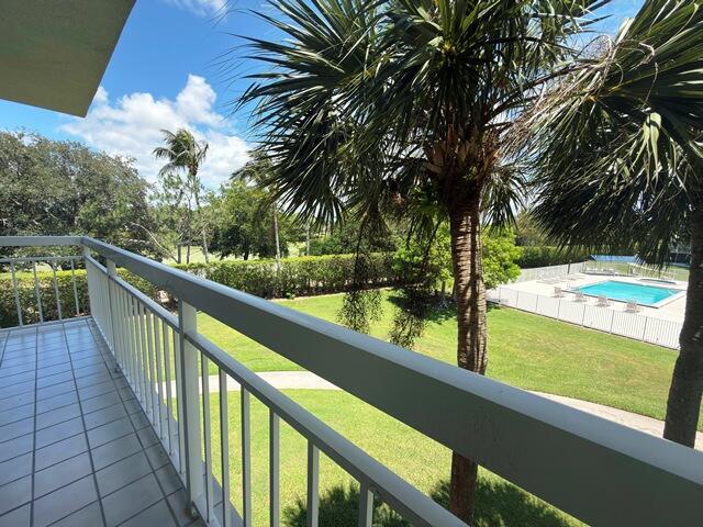 Rare End-Unit overlooking paradise!  Big 2/2 with gorgeous view of tropical greenery and golf course.  Easy walk to pool.  Kitchen offers lots of space and banquette for quick meals.  Huge great room includes massive space for both dining area and living large.  Two big bathrooms with Large Walk-In-Closet!  PRIVATE LAUNDRY and storage room complete the perfect space!  Grab this fast!
