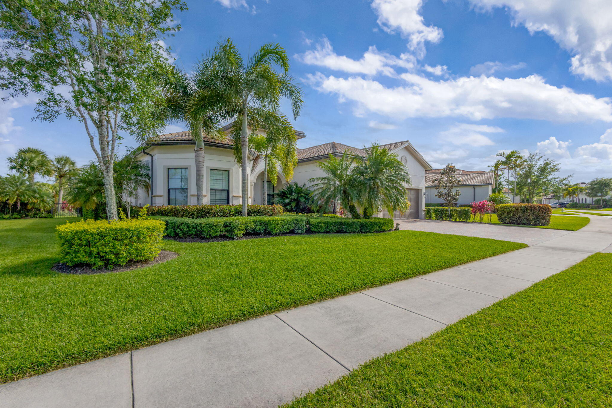Welcome to your own slice of paradise in this beautifully maintained 3 bedroom, 3 bathroom home with a office/den.  Located within the sought-after Divosta built gated community known for its picturesque lake views and exceptional lifestyle amenities. Perfectly situated on an oversized waterfront lot, this residence offers the ideal blend of comfort, functionality, and Florida living.  This home has an open floor plan highlighted by a light-filled kitchen, impact windows, and thoughtfully designed living spaces that seamlessly connect to the outdoors. Enjoy peaceful lake views from your backyard, waterfront retreat, complete with a screened lanai and outdoor kitchen—perfect for entertaining family and friends year-round.