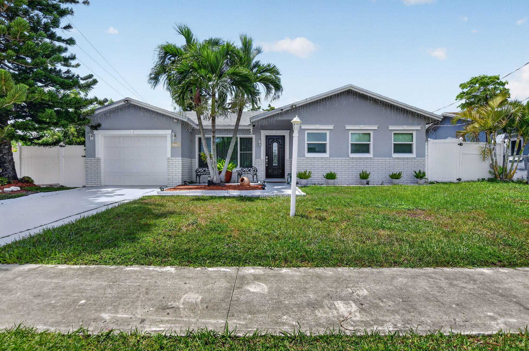 AT SELLERS REQUEST SHOWING START SATURDAY JULY 18th AT THE OPEN HOUSE FROM 11-1PMCompletely updated where it matters most, this move-in-ready West Boca home offers the peace of mind every buyer is looking for with a new roof (2024), new A/C (2025), new water heater (2023), and full hurricane impact protection—including all windows, exterior doors, and the garage door. With the major improvements already completed, you can simply move in and start enjoying your new home.  Inside, you'll find a bright and inviting floor plan filled with natural light, comfortable living spaces, and a layout that flows effortlessly for both everyday living and entertaining. Step outside and discover one of the home's standout features... an incredible covered and screened outdoor living area that feels like an extension of the home itself.  Whether you're hosting family and friends, watching the big game, or simply enjoying your morning coffee, this expansive space offers room for multiple seating and dining areas and can be enjoyed year-round.  The outdoor experience continues with a built-in outdoor kitchen, making weekend barbecues and entertaining effortless. Just beyond, a spacious paver patio lined with mature tropical landscaping creates the perfect setting for relaxing in the Florida sunshine, gardening, or gathering around with friends and family. The fully fenced backyard offers both privacy and plenty of room for children, pets, or future outdoor additions.  Located in the heart of West Boca Raton, you'll enjoy convenient access to parks, shopping, dining, golf, top-rated schools, and major commuter routes while living in a quiet, established neighborhood.  Major Updates Include:  New Roof (2024) New Air Conditioning System (2025) New Water Heater (2023) Hurricane Impact Windows Throughout Hurricane Impact Exterior Doors Hurricane Impact Garage Door Covered & Screened Outdoor Living Area Built-In Outdoor Kitchen Fully Fenced Backyard  Homes with this level of recent improvements, hurricane protection, and exceptional outdoor living are becoming increasingly difficult to find. Don't miss your opportunity to own this move-in-ready West Boca home.