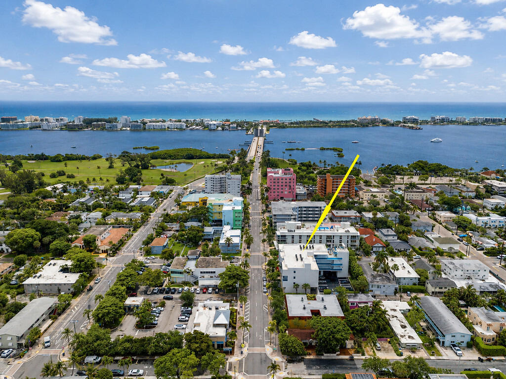 Welcome home to this Stunning Modern Corner Home in the Heart of Lake Worth Beach.  One Luxury is a Boutique Building of 14 Residential Condominiums and 4 commercial spaces on the first floor.  This was the Developer Model home during Construction.  Stunning wrap around Covered Balcony offers over 440 SQ FT of Additional Outdoor living space. 9 Foot Ceiling Throughout.  Entry Foyer with Storage closet and a large walk in storage room on the same level outside the unit. Owner Just installed On Demand Hot water System, new Washer and Dryer, new Wine Fridge  and Induction Cook Top.  Covered Carport Parking included for one vehicle.  Walking Distance to Bryant Park which over looks the intracoastal.  Cross the Bridge and your at Lake Worth Beach. Association Rooftop Spa, Lounge and Grilling .