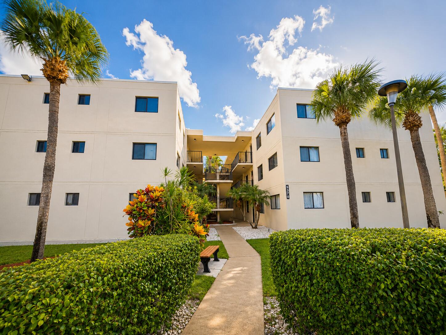 Experience affordable South Florida living in this 1-bedroom, 1.5-bathroom condo located on the third floor of a secure elevator building in a desirable gated Delray Beach community. This well-maintained condo features wood flooring throughout, an in-unit washer and dryer, and a spacious layout with a convenient half bath for guests. The bright living and dining areas provide a comfortable space to relax or entertain. Residents enjoy an exceptional active lifestyle with an impressive array of amenities, including a beautiful clubhouse, three swimming pools, tennis courts, jacuzzis, shuffleboard, scenic walking paths, and a full calendar of social events and activities. Conveniently located near shopping, dining, beaches, and everything Delray Beach has to offer, this condo is an  opportunity for a full-time residence, seasonal getaway, or investment. Terrific value in one of South Florida's most desirable locations!
