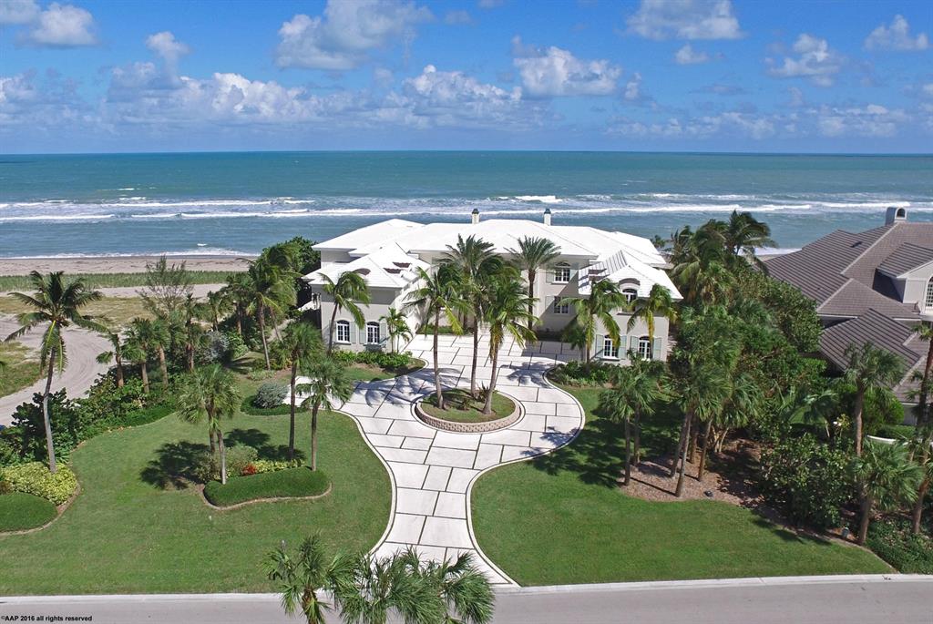 PRICED BELOW RECENT PROFESSIONAL APPRAISAL! Discover this truly magnificent oceanfront estate located in Sailfish Point! The unique selling proposition of this oceanfront home is it is the only home available with mile views of the beach to the North & the South. In addition, it is an easy short walk to the Marina with the ability for all size vessels, including yachts up to 130ft. For protection this home also has a newer seawall on the ocean side, which is extremely rare for oceanfront homes in Florida. This stunning estate on over an acre of land and 150+ feet of beach frontage is designed for grand entertaining or luxurious, casually elegant beachside living and offers a sprawling floor plan. Infinity pool/spa, elevator, stone floors & granite baths, chef's gourmet kitchen plus prep-kitchen, stone wine room, exercise room & high ceilings with endless crown moldings. The master suite boasts expansive ocean views with his & her walk-in closets & bath wings. Sailfish Point offers the ultimate Florida luxury resort lifestyle with a full service marina, fine & casual dining, Har-Tru tennis courts, Jack Nicklaus signature golf course & patrolled 24/7!