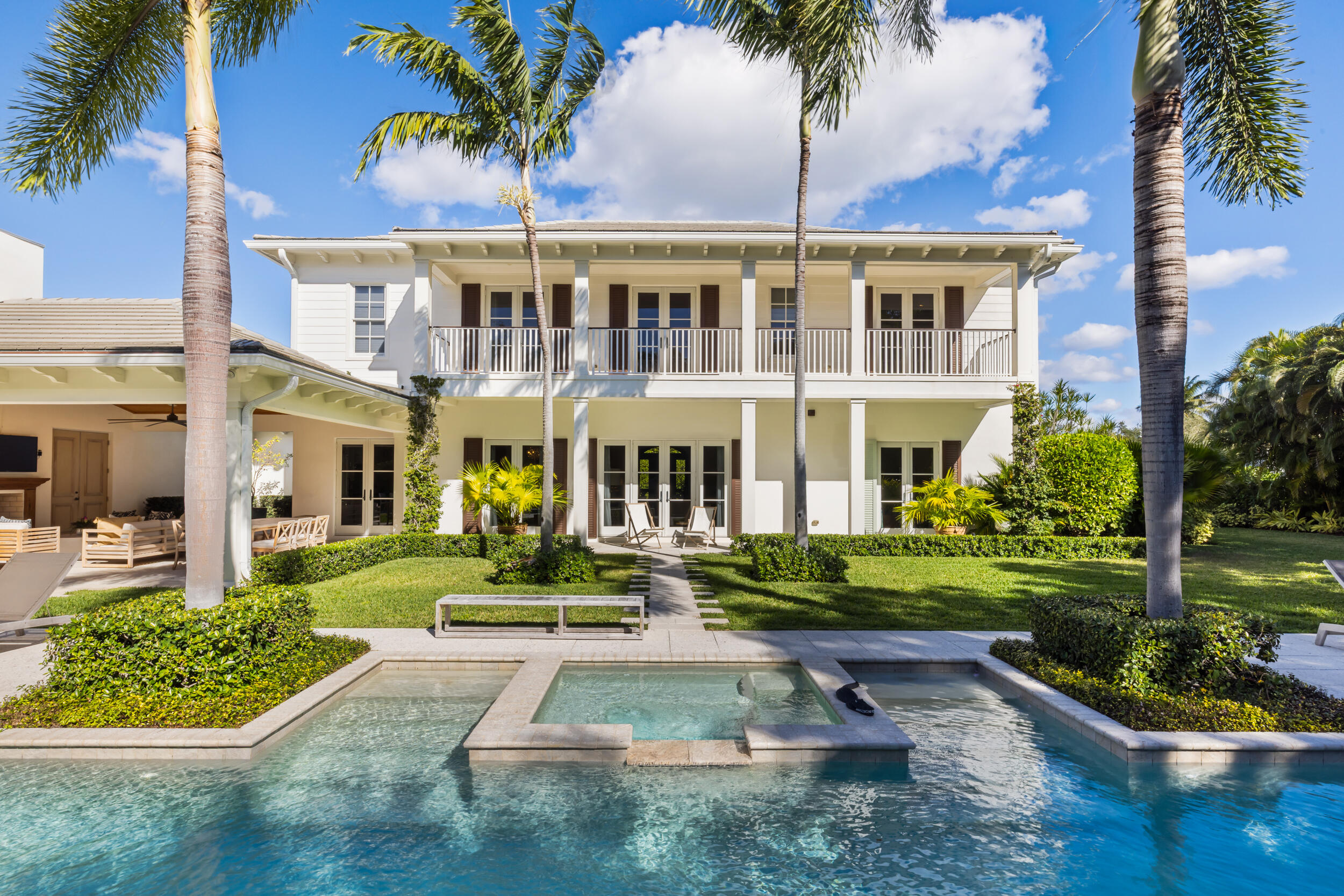 Nestled on an expansive over half-acre lot just off the prestigious South Flagler Drive, this remarkable residence offers an unparalleled blend of space, seclusion, and sophisticated outdoor living, complemented by amazing Intracoastal breezes. Thoughtfully designed for both everyday comfort and effortless entertaining, the home boasts an open-concept kitchen, perfect for gathering. The oversized primary suite is a true retreat, complete with his-and-her baths, dual closets, a seating area with intracoastal views, and serene privacy.

For moments of leisure, enjoy the dedicated theater room with a wet bar or step outside to the sleek lap pool and sprawling loggia, where indoor and outdoor living harmoniously merge. Framed by lush, meticulously designed landscaping, the property provides generous outdoor spaces for relaxation or hosting unforgettable gatherings.

All of this is just seconds from the Intracoastal and mere moments from the vibrant energy of Downtown West Palm Beach, the elegance of Palm Beach Island, and an array of world-class dining, shopping, and cultural attractions. This is more than a homeit's a lifestyle.