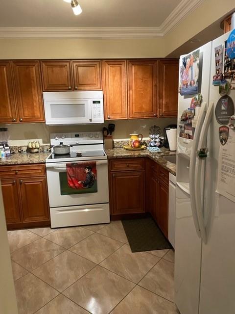 This beautiful 2bed/2bath is ready to move-in just bring your belongings. Upgraded kitchen, tile throughout, open porch with impact windows. Laundry in the unit. Master bathroom has walk-in shower and master bedroom has walk-in closet. Also has an exterior closet outside near the elevator.  The Unit is being sold As-Is and furnished. This Condo has already passed 40 years inspection. Located near major roads. Waters Edge is well maintained community and offers a heated pool, spa/sauna, clubhouse, fitness room, billiard room and a lake front barbecue area. Nearby restaurants, shopping plaza and entertainment. Must have 700+credit score and it doesn't require minimum down payment. MUST SEE IT!