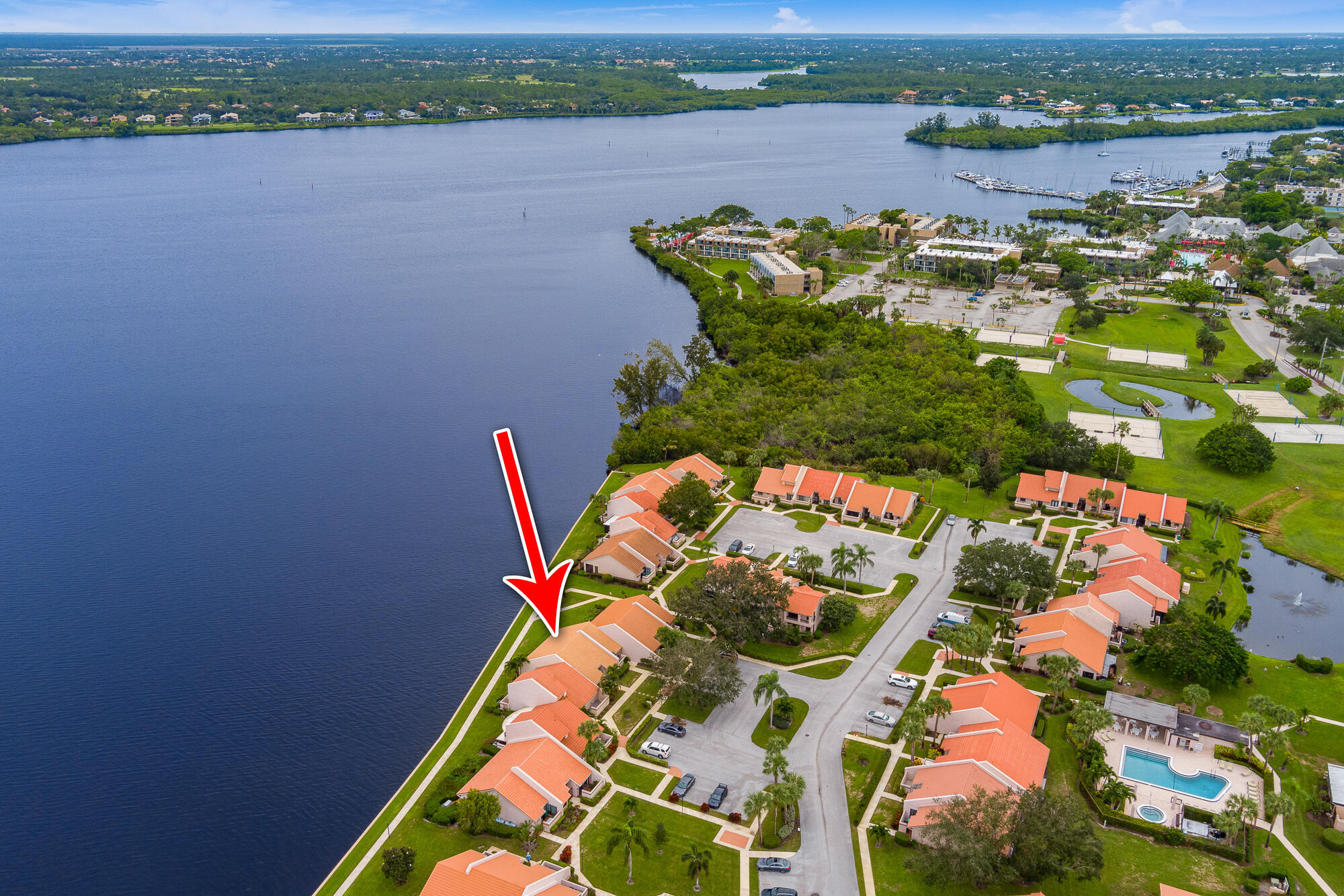 DIRECT WATERFRONT Villa with spectacular river views (Per FEMA flood map, flood insurance is not required!!). 3 Bedrooms with 3 full baths and two master suits! New roof in 2018. Impact glass windows and doors in 2016 (except front door and sidelight). Renovated with newer flooring, newer kitchen and newer water heater. Community offers pool/spa, community dock & gazebo. When you walk in the door you will be impressed with the cathedral ceilings and the beautiful wide water view!!!
