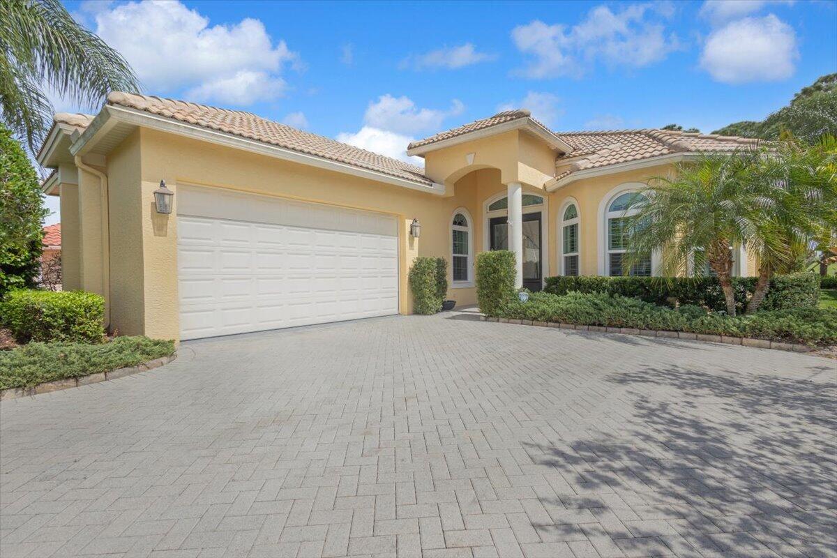 Exceptional home shows like a MODEL in Oak Hill at PGA Village with gorgeous expansive Golf Views of the Ryder Golf Course #1 Fairway. Beautiful Updated home features CBS Construction, Barrel tile roof, large paver driveway, Impact Hurricane windows & doors. Hosts double door etched glass French doors, 2 BR's, Den/office, 2.5 BA's & 2 Car Garage with storage. Details include design colors, Volume ceilings, Plantation Shutters, tile & wood flooring, crown molding, upgraded lighting & attention to details. Split floor plan, Re-done open kitchen includes stainless steel appliances, breakfast bar, pantry, granite counter tops & pendant lighting. Spacious Screen enclosed lanai overlooking Breathtaking Golf View & minutes away from the PGA Golf Club.  Some furniture negotiable.   HOA includes Manned gated security, cable, internet, lawn care, common areas, cleaning of your roof & the Island Club with something for everyone. Resort style pool, fitness center, library, billiards, tennis, pickleball, clubs, entertainment & travel. PGA Boasts 3 Champion Semi-private Golf Course & Legacy offering private membership. You do not have to join any golf memberships to live in PGA Village but for those who wish to join there are plenty off different opportunities such as golf, social or tennis memberships. Located close to shopping, restaurants, hospital, doctors, certainly golf courses & even home of the NY Mets Spring Training.