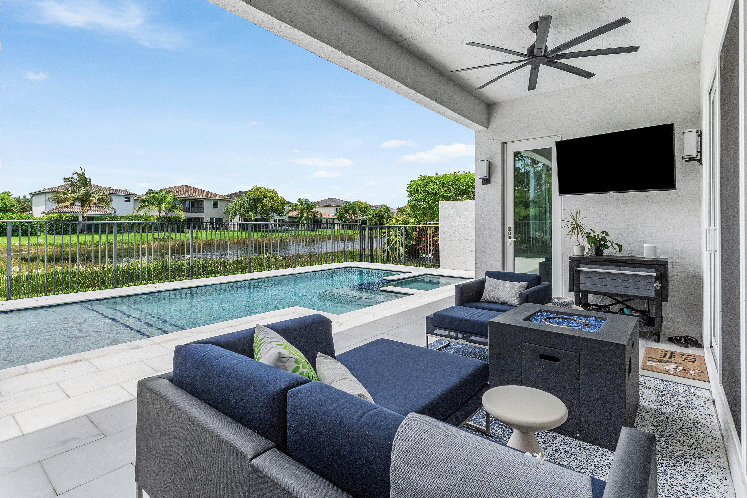 Beautiful one-story waterfront pool home in GL Homes' Dakota with an open floor plan. The gourmet kitchen features SS appliances, a designer chimney hood, upgraded cabinetry with a built-in pantry and pull-out drawers, quartz countertops and a designer tile backsplash. The private primary suite with patio access offers custom his-and-her closets and a spa-inspired bath with dual vanities, a frameless glass shower and floor-to-ceiling tile. Enjoy the resort-style backyard with a saltwater pool with a heater/chiller. Upgrades include custom family room and office built-ins, extensive moldings, designer lighting, porcelain tile, luxury finishes throughout, and exceptional attention to detail.  Resort Style Community, Pickleball, Playground, Card Room and more !A Must See !