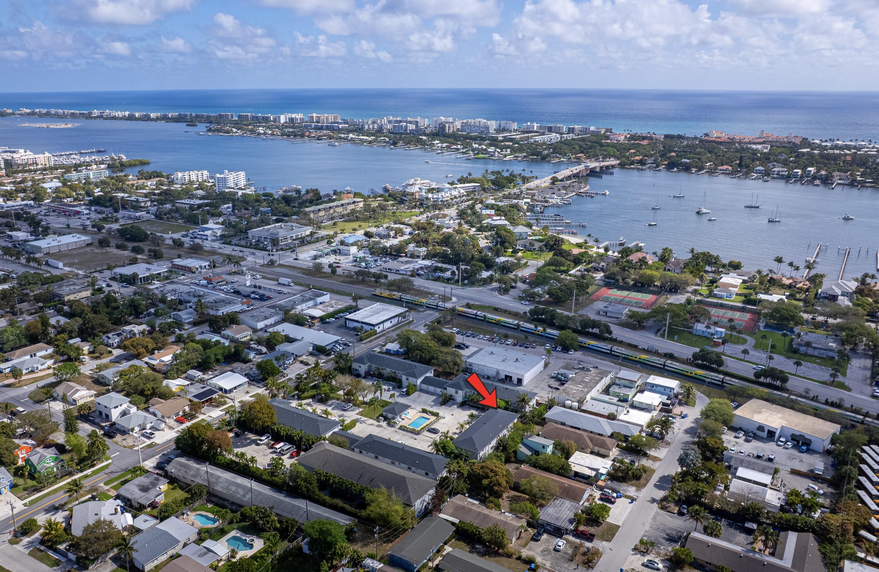 Charming Key West-inspired corner townhome featuring 2 bedrooms, 2 bathrooms, a private sauna, and a one-car garage, located on one of the largest lots in this boutique community of only 26 homes. Enjoy a wraparound garden area and spacious patio, perfect for relaxing or entertaining. The home features a beautifully updated kitchen with stainless steel appliances, granite countertops, wood flooring, and accordion shutters throughout. The owner's suite offers a walk-in closet, with washer and dryer conveniently located upstairs. Just steps from the community pool and walking distance to the Intracoastal and the beach. Ideally located 15 minutes to Delray Beach and 20 minutes to PBI Airport and Downtown West Palm Beach. No rental restrictions.  A/C 2025 Roof 2023. A must see!