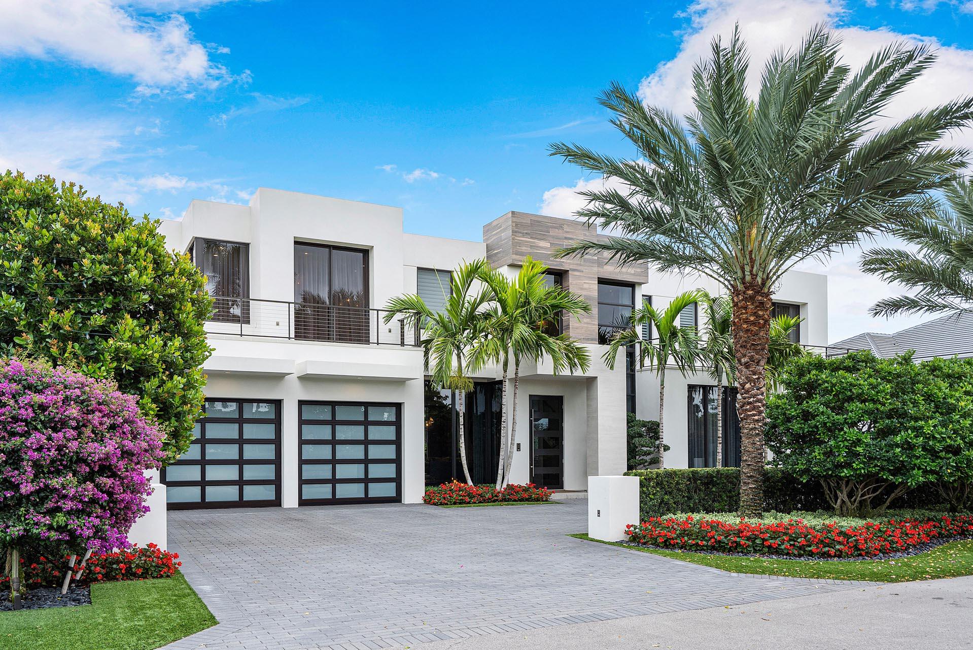 1440 Thatch Palm Drive is an SRD Building Corp Signature Estate, with interior design by world-renowned Marc-Michaels. All custom designed furnishings are included. Appointed with incredible rear and front views of the Jack Nicklaus Signature Golf Course. Stepping inside, you are immediately greeted by designer lighting and wall coverings, custom architectural finishes, and sleek, white porcelain tile that comprises the entire first floor. The front door leads into the living room, which includes a beautiful marble fireplace. The property takes advantage of its golf course location, as the living room's floor-to-ceiling windows offers views of the 7th & 17th fairways. Timeless and tasteful style imagined by the designer is found inside the 4-bedroom, 6,700+ sq ft of living space. The home includes a formal dining area, club room with chic bar, private study, multiple living rooms, and sprawling 2nd-floor main suite complete with a morning bar, His & Her spa baths, and boutique closets. The backyard has sunny eastern exposure and is a paradisical escape. The covered terrace offers many seating options, summer kitchen & bar, a stunning pool with a spa, sun shelf, and fire/water feature. The home has a fully integrated Crestron smart-home system, a whole-house natural gas generator, and exceptional craftsmanship and finishes.