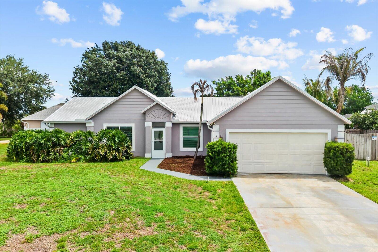 Step into a 3 BEDROOM, 2 BATH POOL HOME on a quarter acre - CORNER LOT. NEW IMPACT WINDOWS & DOOR, NEWER REMODELED KITCHEN, FENCED BACKYARD, FAMILY ROOM, and separate LIVING ROOM made for true Florida living. Beautiful newer Metal Roof (2020), Hot water heater (2024),  This home offers a comfortable layout with an EAT-IN KITCHEN, FORMAL DINING AREA, INSIDE LAUNDRY, and flexible spaces to relax, gather, and entertain. Enjoy your own backyard retreat with a private pool setting perfect for weekends, cookouts, and quiet evenings at home. Conveniently located near I-95, the FL TURNPIKE, shopping, dining, parks, entertainment, Tradition, Clover Park, PGA Golf, and the beautiful TREASURE COAST BEACHES. A great opportunity for buyers looking for space, lifestyle, and location in Port Saint Lucie.