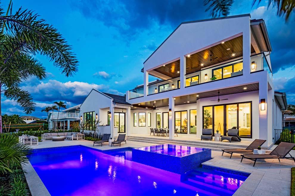 Welcome to 27 Eleuthera Dr; a brand new waterfront estate by Stephen Varga Homes in Ocean Ridge. Boasting 100 feet of waterfrontage with Intracoastal views, the quality built residence offers a clean modern transitional design with 5,923 total square feet; five bedrooms with first-floor master wing and second-floor VIP suite; formal dining and living rooms; open kitchen with family room; and loft. Enjoy outdoor living and entertaining with covered loggia, pool with spa, summer kitchen, private dock with lift, and nearby inlets for easy ocean access. This brand new custom-built home has been professionally decorated by Ava Gray Interiors to compliment the complete luxury waterfront lifestyle. Enjoy the tranquil setting, beautiful water vistas and incredible opportunity that awaits. Nestled on Inlet Cay, on one of Ocean Ridge's picturesque islands, 27 Eleuthera Drive enjoys tranquility and privacy with nearby beach access path for Ocean Ridge residents' use. The Town of Ocean Ridge is perfectly located in the heart of Palm Beach County. Enjoy the pleasant drive along A1A to Delray Beach's Atlantic Avenue, Palm Beach's Worth Avenue and all stops in between. Traveling is a breeze with several private jetports and three international airports nearby. Boaters will appreciate the nearby Boynton Beach and Boca Raton inlets for trips to the Atlantic Ocean.

Features
*100 feet of waterfrontage with Intracoastal Waterway views and private dock with loft
*Approximately 3,975 under AC SF
*Approximately 5,923 SF Total 
*Upscale contemporary lifestyle home built by Stephen Varga Homes
*5 bedrooms
*5 full bathrooms and 1 powder room
*Side entry 2-car garage for privacy
*Lot size - 100' frontage/waterfrontage x 125' depth (0.287 acres)
*Lot - exceptional elevation with pool and home set on pilings
*Professionally landscaped grounds with sensational curb appeal and decorative drive
*Front porch with impressive oversized glass door entry
*Custom hardware and finishes
*Volume ceilings with coffer details
*Light and bright with impact windows and doors throughout
*Contemporary rectified porcelain floors downstairs and wood floors upstairs
*Stunning Brita blue polished quartzite in kitchen
*Crystal opal white polished marble in master baths
*Custom designed cabinetry and countertops
*Clean lines, neutral palette and beautiful water vistas throughout
*Foyer entry stairway with custom glass railings
*Open living and dining rooms with glass sliders and gorgeous water views 
*Chef's kitchen with mother of pearl backsplash and top-of-the-line appliances including wine cooler
*Kitchen island with snack bar, breakfast nook and cocktails bar with lots of storage
*Family room with sliders to summer kitchen, pool and dock
*First floor master wing with private covered loggia and walk-in closets
*Master bath with soaking tub, oversized custom walk-in shower, make-up vanity, dual vanities and water closets
*First floor en suite guest quarters
*Service hallway off kitchen leads to powder room, laundry room and garage
*Custom stairway with glass railings and oversized picture window for natural light
*Upstairs loft can serve as sitting area, casual living room, office or recreation area
*Second floor VIP suite with large walk-in closet, spacious bath and private access to the balcony
*Two additional en suite guest rooms upstairs with balcony access
*Coastal interior space easily transitions to outdoor living for retreats and entertaining alike
*Covered loggia with summer kitchen and delightful waterviews
*Heated pool with sun shelf and spa
*Expansive open poolside patio with ample room for sun and fun
*Private dock with boat lift
*Nearby inlet for easy access to the Atlantic Ocean
*All closets have been built-out
*Interior glass rails and shower doors in low iron/starfire glass for maximum clarity to bring out colors of tiles and home accents
*Pre-wired for security system, audio-visual and Smart Home controls
*Two-car garage with attic storage
*Impact glass windows and doors throughout
*Linear AC diffusers
*Multi-zone AC
*High-efficiency AC and water heater
*Retracting central vacuum system
*Nickel joint tongue and groove wood ceilings in outdoor covered areas
*Artistic Sherlock pavers patio and driveway made with seashell fragments
*Concrete tile roof
*Furnishings can be purchased separately from Ava Gray Interiors

This brand-new coastal home provides both tranquility and five-star amenities representing the very best of the Palm Beaches. Come live the luxury lifestyle today!