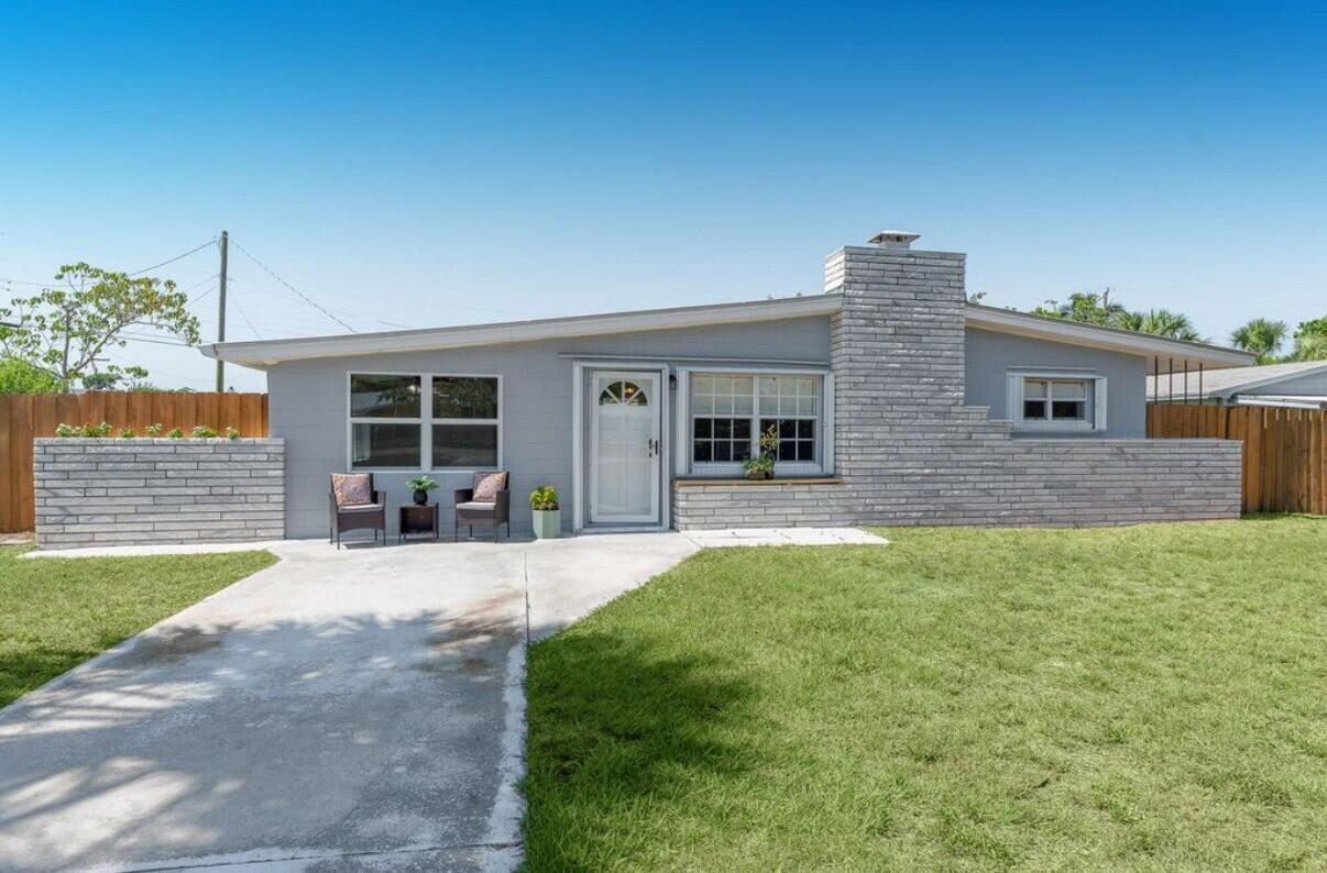 Walk to Downtown Jensen Beach, just 3 miles from the beach, and full of coastal charm! Welcome to this beautifully updated, well-maintained coastal retreat in the heart of Jensen Beach. This charming 3-bedroom, 2-bath home sits on an oversized corner lot just a short walk to vibrant Downtown Jensen Beach and only 3 miles from the area's beautiful beaches. Designed for both everyday living and weekend escapes, the property features two separate driveways, an oversized detached two-car garage, and plenty of space to park a boat, RV, or additional vehicles—all with no HOA restrictions. Inside, you'll find warm cedar wood ceilings, timeless terrazzo flooring, a cozy fireplace, and an updated kitchen featuring butcher block countertops and newer stainless steel appliances.  The renovated bathroom, along with a brand-new washer and dryer, adds modern convenience while maintaining the home's character. Step outside to your private, fully fenced backyard complete with a spacious deck, gazebo, and outdoor shower—perfect for rinsing off after a day at the beach or out on the water. Whether you're searching for a primary residence, a family home, the perfect beach getaway, or an investment opportunity, this move-in-ready property offers an unbeatable combination of location, charm, and lifestyle. Don't miss your opportunity to own a piece of paradise in one of Jensen Beach's most desirable locations. Schedule your showing today!
