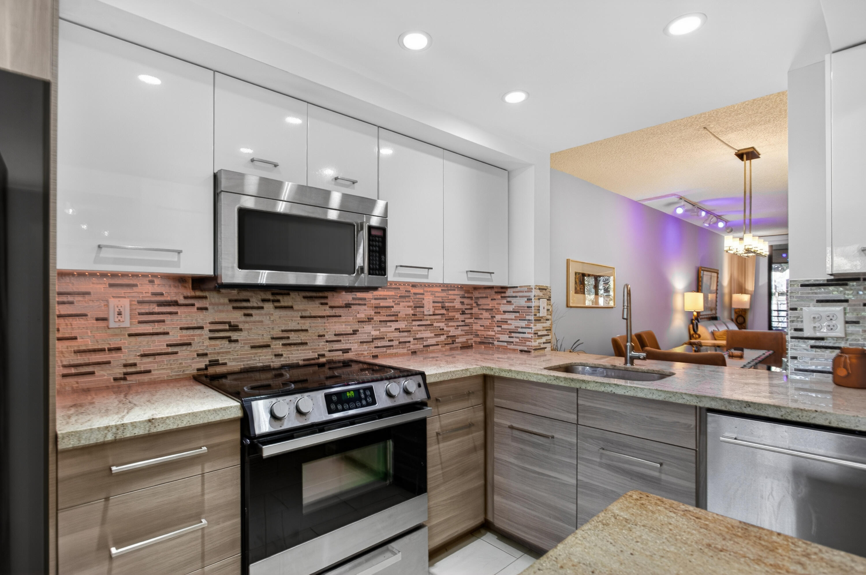 Bright, beautiful, and thoughtfully designed, this modern 2-bedroom, 2-bath home offers an excellent split-bedroom floor plan in a quiet, well-maintained gated community. The open, light-filled kitchen features a center island and a cozy breakfast nook, perfect for casual meals, while still offering ample space for a full dining room set. Tastefully designed kitchen and bathrooms add to the home's modern appeal. Enjoy a screened balcony/den with private access from the spacious primary bedroom, which includes three closets—two of them walk-ins. With abundant storage throughout, a full-size washer and dryer, and the option to be offered furnished or unfurnished, this gated community provides privacy, comfort, and a serene neighborhood setting.