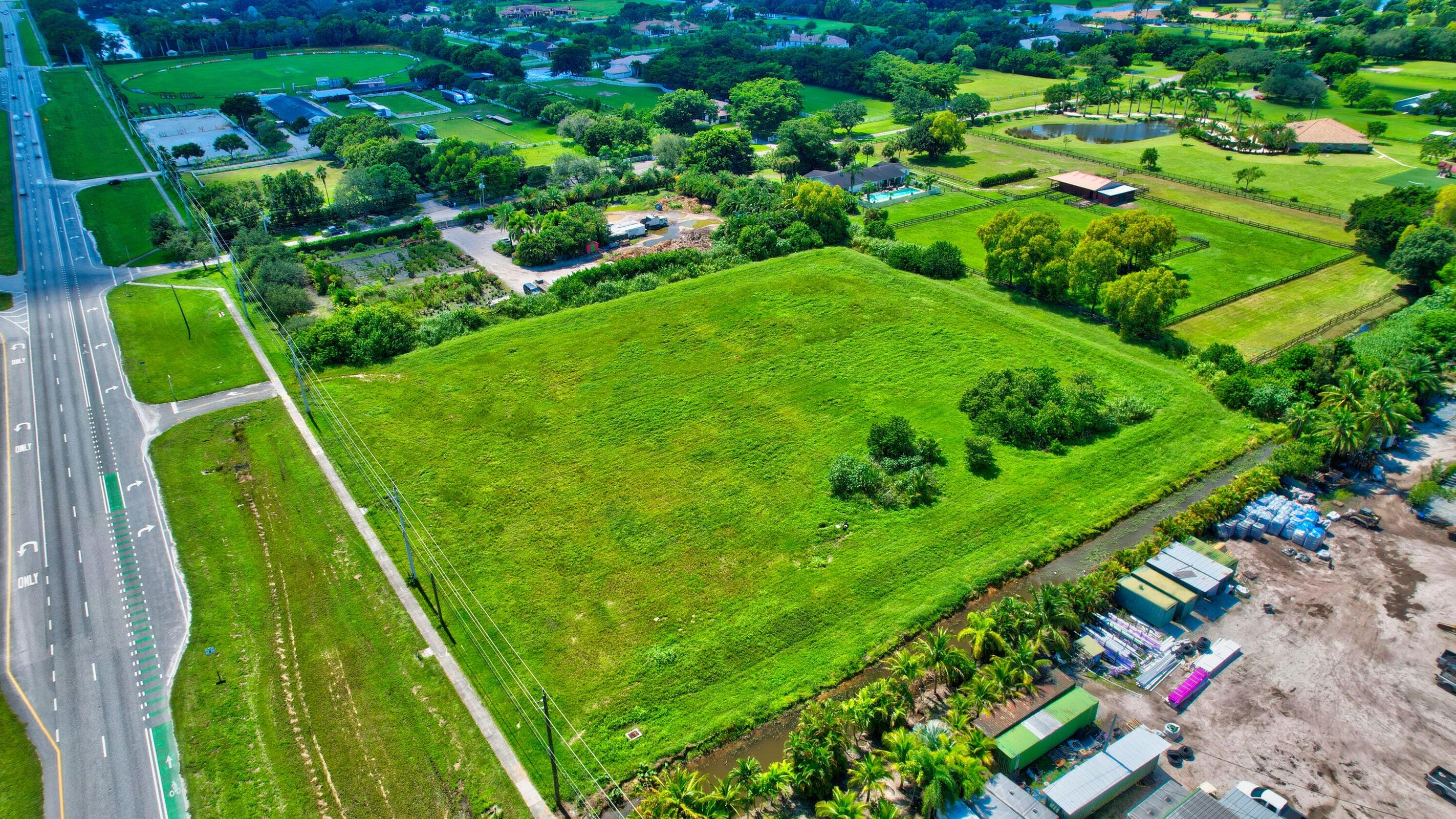 Discover the possibilities with this exceptional 3.63-acre parcel in Delray Beach, located directly on 441. Currently zoned agricultural, the property offers strong potential for rezoning to medical, professional office, or retail use. Whether you're an investor seeking long-term growth or a visionary ready to shape the future of Delray Beach, this versatile property is your canvas. Don't miss the opportunity to transform this prime acreage into a thriving hub of productivity.. Can be purchased together with the adjacent lot of 2.7 acres, a total of 6.4 acres of prime real estate