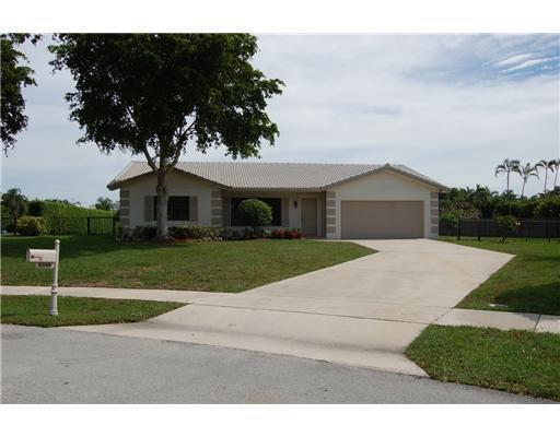 Welcome to this single-story residence in the desirable Timbercreek community of Boca Raton, featuring four bedrooms and 2.5 bathrooms across 2,261 square feet of finished living space. This home offers the convenience of a two-car garage and oversized lot, providing a unique lifestyle opportunity. The thoughtful floor plan accommodates both everyday living and entertaining needs with generous room configurations.