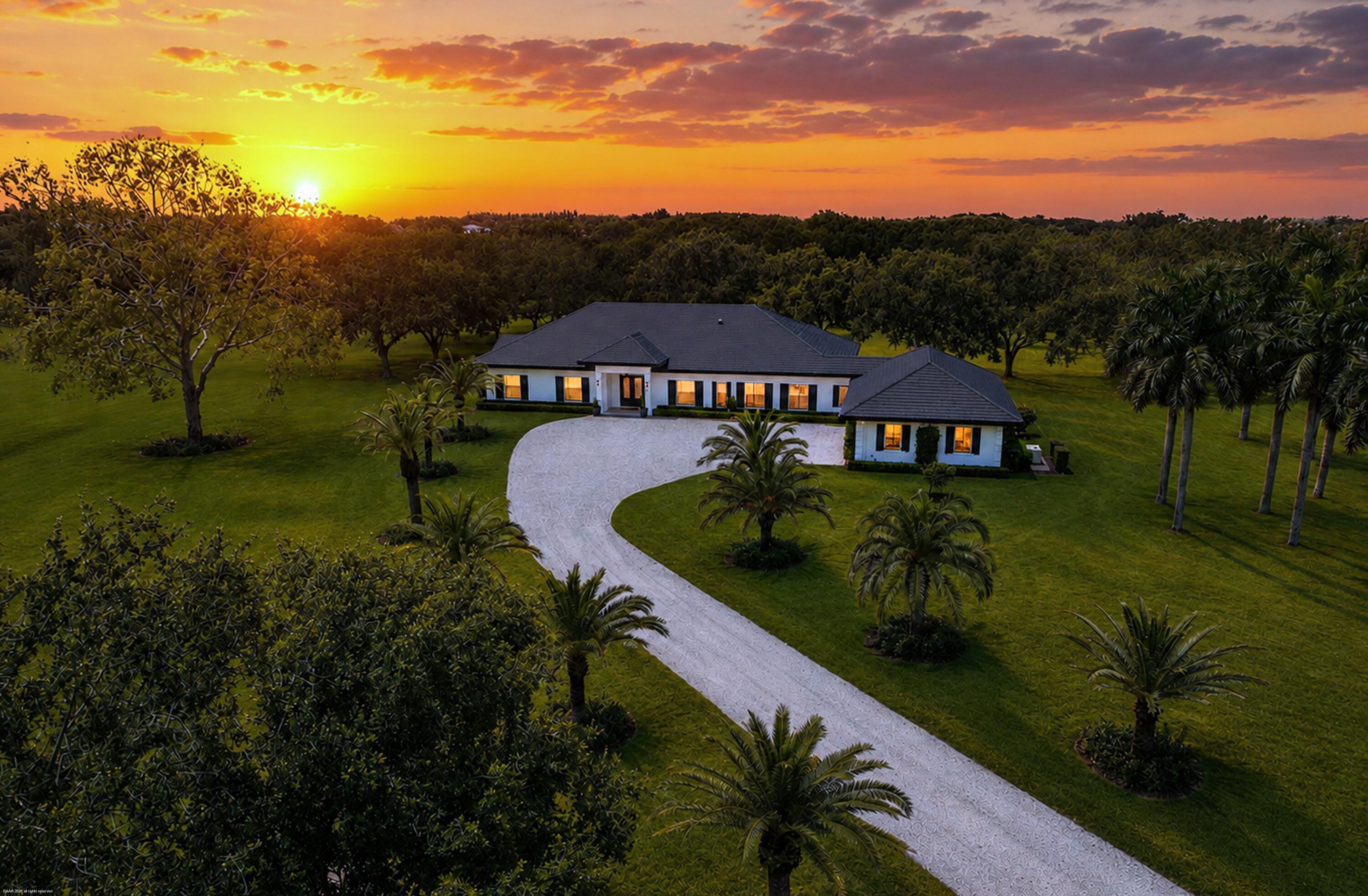 An extraordinary 14-acre estate, located within Wellington's Rustic Ranches Estates. Offering 4 Bedrooms, 3.5 Bathrooms, 3,762 SF Living Space, 3-Car Garage, Waterfront Setting, 14 Acres of Endless Possibilities Enjoy peaceful water views, exceptional privacy, and the opportunity to create the equestrian estate you've always envisioned. With ample room for barns, arenas, paddocks, and a custom equestrian facility, this property offers the perfect blend of luxury, land, and location. Just minutes from Wellington's world-renowned equestrian venues, shopping, dining, and top-rated schools. Significant engineering site work has been done by the current owner. Come enjoy beautiful sunsets, quiet open space with lovely landscape, all ready for your final touches to make this your dream estate.