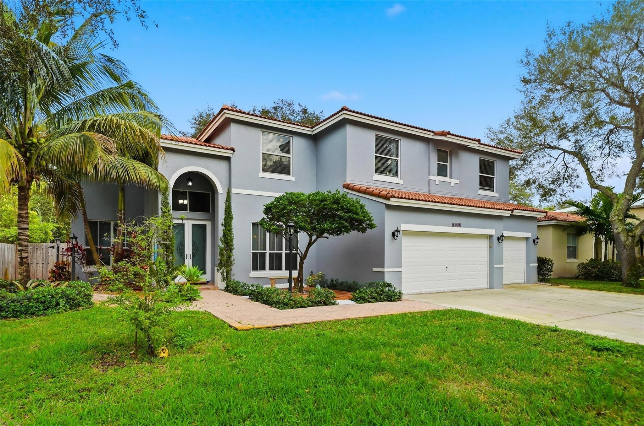 LOCATED IN THE GATED COMMUNITY OF COQUINA, THIS 5-BED, 3-BATH RESIDENCE IS PRIVATELY SITUATED ON A CUL-DE-SAC. THE HOME FEATURES CROWN MOLDING THROUGHOUT, CATHEDRAL CEILINGS, AND A FORMAL DINING ROOM. THE LARGE KITCHEN IS EQUIPPED WITH STAINLESS STEEL APPLIANCES, ABUNDANT CABINETRY, WITH WINDOWS PROVIDING NATURAL LIGHT. THE PRIMARY SUITE IS LOCATED ON THE 2ND FLOOR AND OFFERS A LARGE SITTING AREA THAT COULD BE CONVERTED INTO AN ADDITIONAL BEDROOM. A FULL BATH AND TWO BEDROOMS ARE CONVENIENTLY LOCATED ON THE 1st FLOOR. PRIVATE FENCED BACKYARD INCLUDES A SCREENED-IN PATIO, PAVER WALKWAYS, AND AMPLE OUTDOOR SPACE. 2-CAR GARAGE PLUS A THIRD BAY IDEAL FOR STORAGE OR A GOLF CART.  COMMUNITY POOL AND PLAYGROUND.