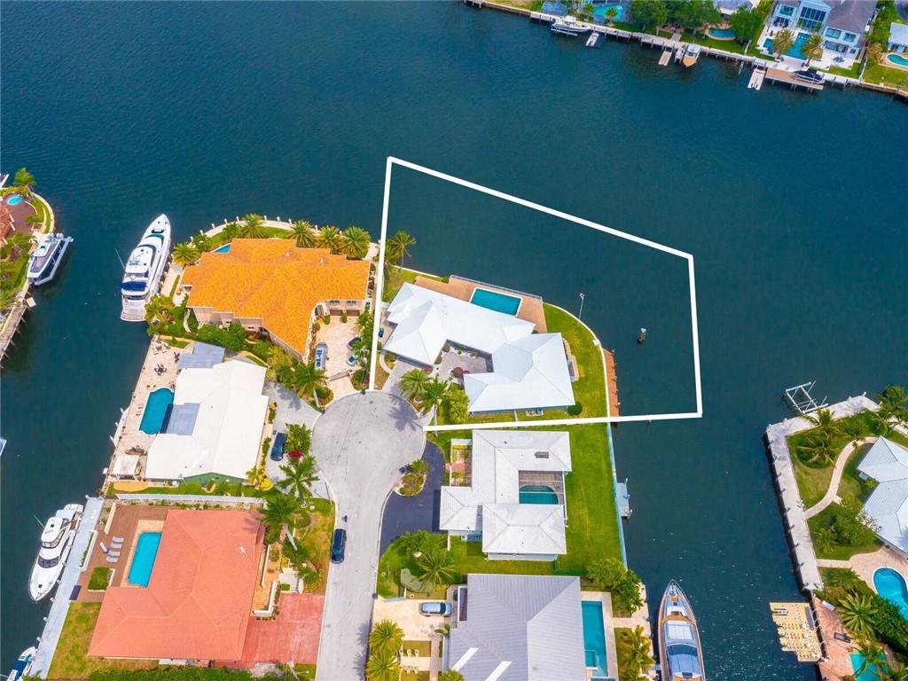 HIGHLY DESIRABLE WATERFRONT POINT LOT located on a QUIET CUL-DE-SAC in EXCLUSIVE GATED COMMUNITY of SUNRISE KEY! Potential MEGA YACHT DOCKAGE for approx. 170+/- YACHT on the North Face with room for ANOTHER 80+/- VESSEL on the East Face. LESS THAN 2 MILES from the BEACH & LAS OLAS BOULEVARD. SUPERB WIDE OPEN PANORAMIC WATER VIEWS! PRIME DOCKAGE (2 docking locations) perfect for large/multiple yachts. DEEP WATER, QUICK OCEAN ACCESS, NO FIXED BRIDGES. Original property line WF 235ft.. NEW POTENTIAL WF DOCKAGE 250ft.Current home is dated but in pristine condition. REMODEL or TEAR DOWN & BUILD YOUR DREAM HOME. ONE OF THE LAST POINT LOTS AVAILABLE IN EAST FORT LAUDERDALE! LOCATION, LOCATION! HIGHLY DESIRABLE WATERFRONT POINT LOT located on a QUIET CUL-DE-SAC in EXCLUSIVE GATED COMMUNITY of SUNRISE KEY! Potential MEGA YACHT DOCKAGE for approx. 170+/- YACHT on the North Face with room for ANOTHER 80+/- VESSEL on the East Face. LESS THAN 2 MILES from the BEACH & LAS OLAS BOULEVARD. SUPERB WIDE OPEN PANORAMIC WATER VIEWS! PRIME DOCKAGE (2 docking locations) perfect for large/multiple yachts. DEEP WATER, QUICK OCEAN ACCESS, NO FIXED BRIDGES. Original property line WF 235ft.. NEW POTENTIAL WF DOCKAGE 250ft.Current home is dated but in pristine condition. REMODEL or TEAR DOWN & BUILD YOUR DREAM HOME. ONE OF THE LAST POINT LOTS AVAILABLE IN EAST FORT LAUDERDALE! LOCATION,​​‌​​​​‌​‌​​​‌‌​​​‌‌‌​​‌​​‌‌​​​​ LOCATION!