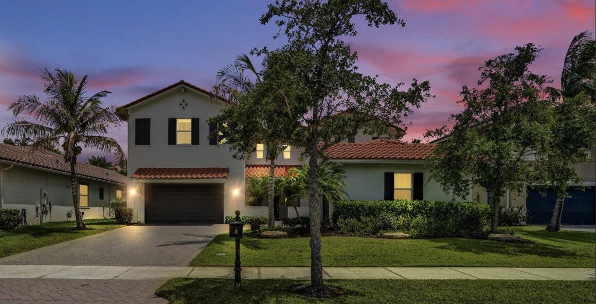 Stunning Parkland residence blending luxury, comfort, with smart home technology. Soaring volume ceilings and beautiful hardwood flooring throughout. Gourmet kitchen features a dramatic oversized granite island, stainless steel appliances (2023), custom bar/coffee station, walk in pantry, reverse osmosis water purification system. Outdoor entertaining space (2023) with pergola, summer kitchen, granite finishes, outdoor refrigerator. Elan Smart Home System, impact windows and doors, custom automated shades and designer linen window treatments, painted interior (2024), fenced yard, and three car garage. Spacious primary suite features custom closets, oversized shower, and soaking tub. First floor bedroom with full cabana bath. Guard gated,resort style community.A rated schools