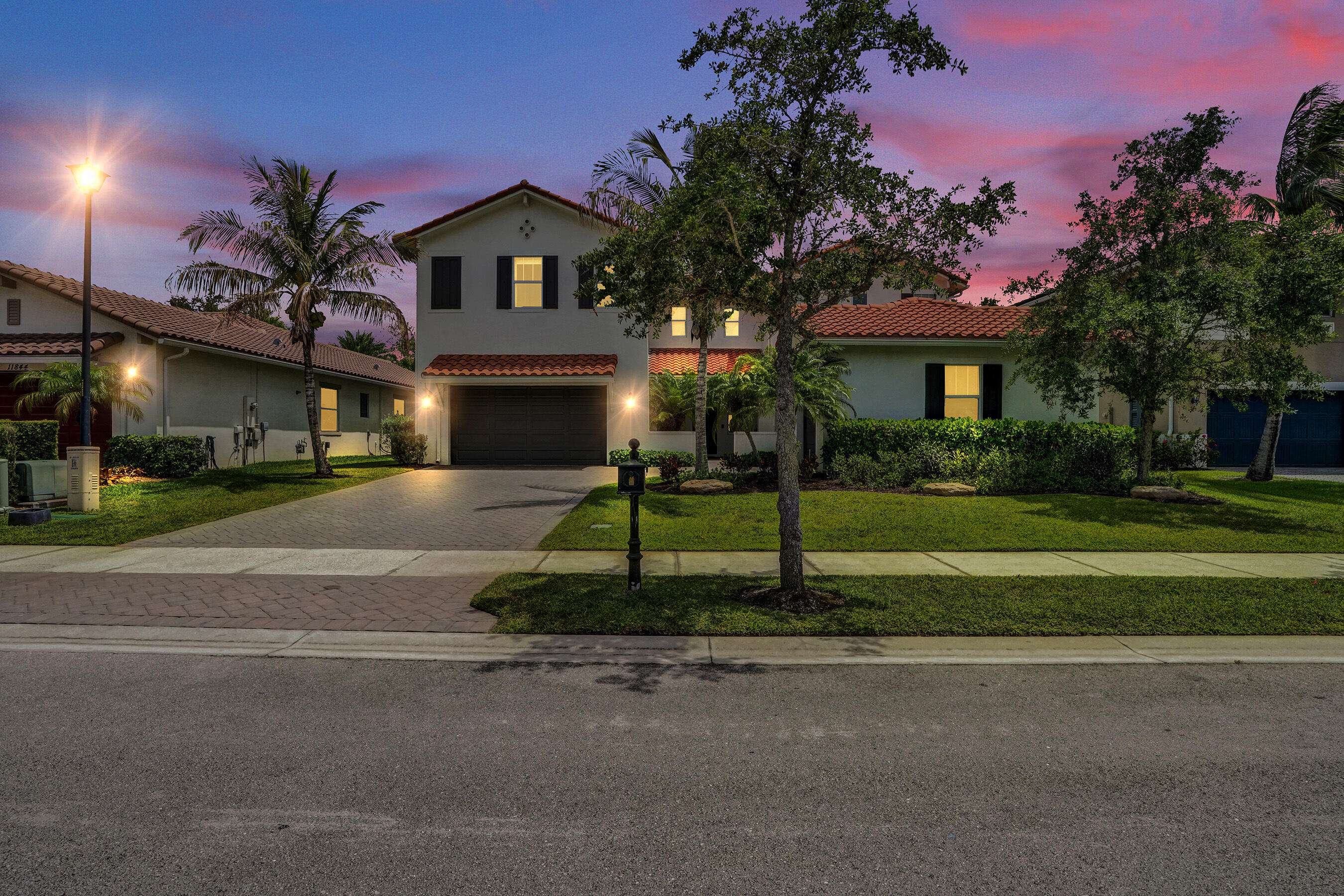 Stunning Parkland residence blending luxury, comfort, with smart home technology. Soaring volume ceilings and beautiful hardwood flooring throughout. Gourmet kitchen features a dramatic oversized granite island, stainless steel appliances (2023), custom bar/coffee station, walk in pantry, reverse osmosis water purification system. Outdoor entertaining space (2023) with pergola, summer kitchen, granite finishes, outdoor refrigerator. Elan Smart Home System, impact windows and doors, custom automated shades and designer linen window treatments, painted interior (2024), fenced yard, and three car garage. Spacious primary suite features custom closets, oversized shower, and soaking tub. First floor bedroom with full cabana bath. Guard gated,resort style community.A rated schools